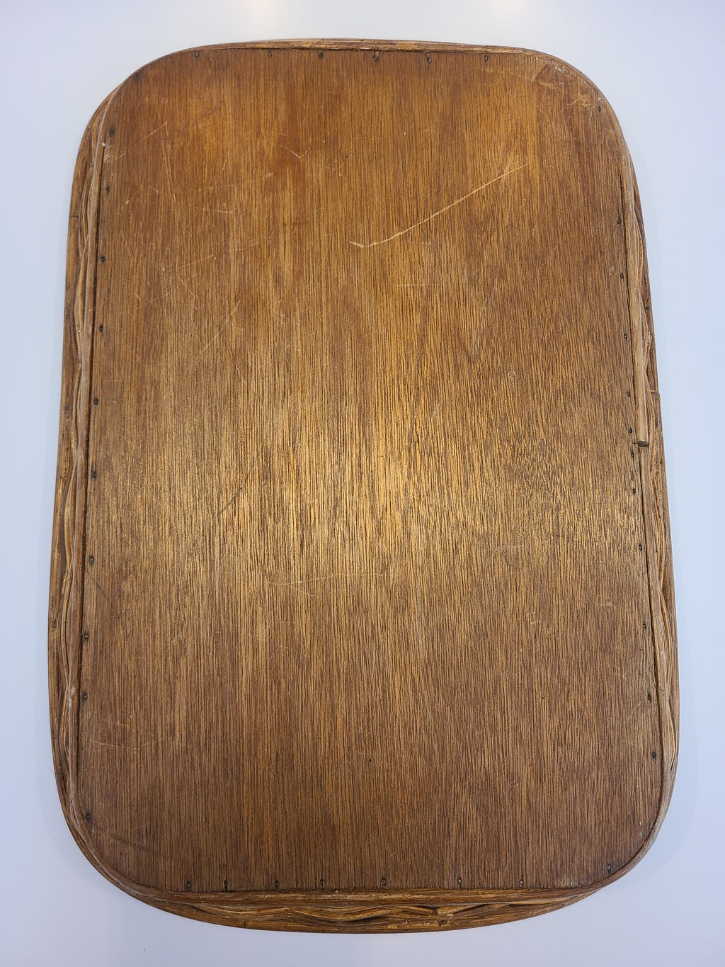 Underside of vintage capiz shell tray with rattan border