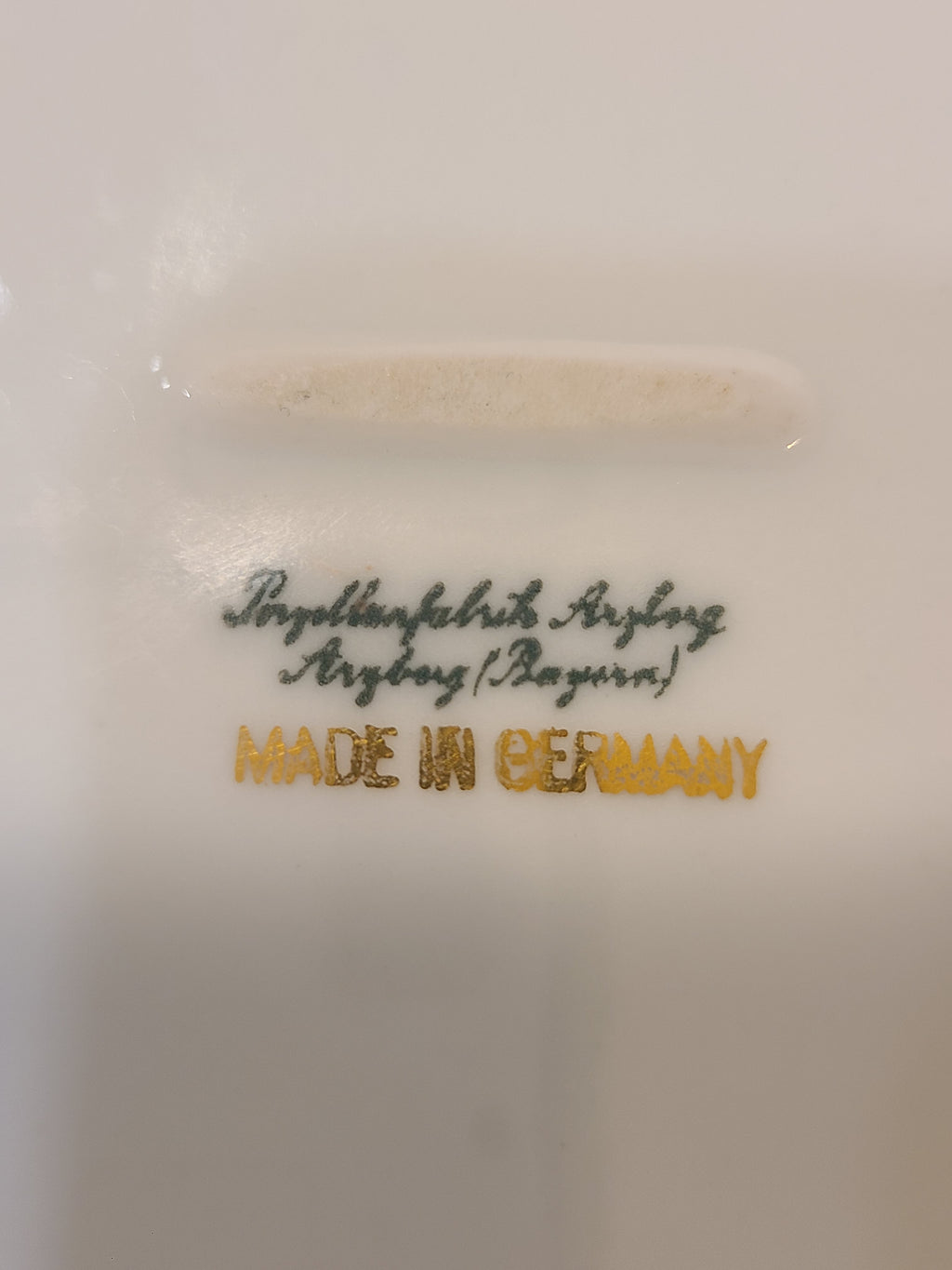 Close up of bottom stamp of vintage white porcelain bowl by Porzellanfabrik Arzberg.