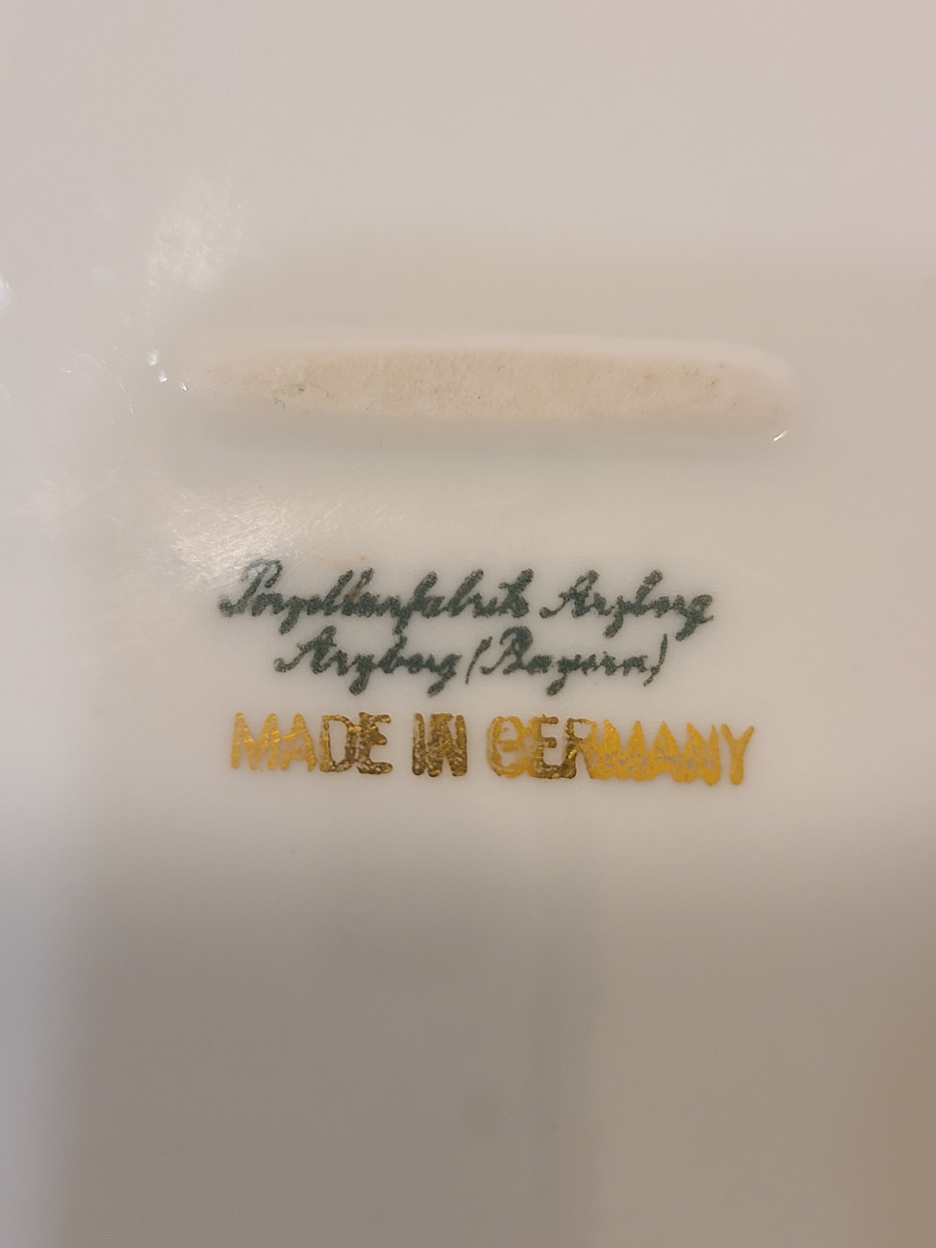 Close up of bottom stamp of vintage white porcelain bowl by Porzellanfabrik Arzberg.
