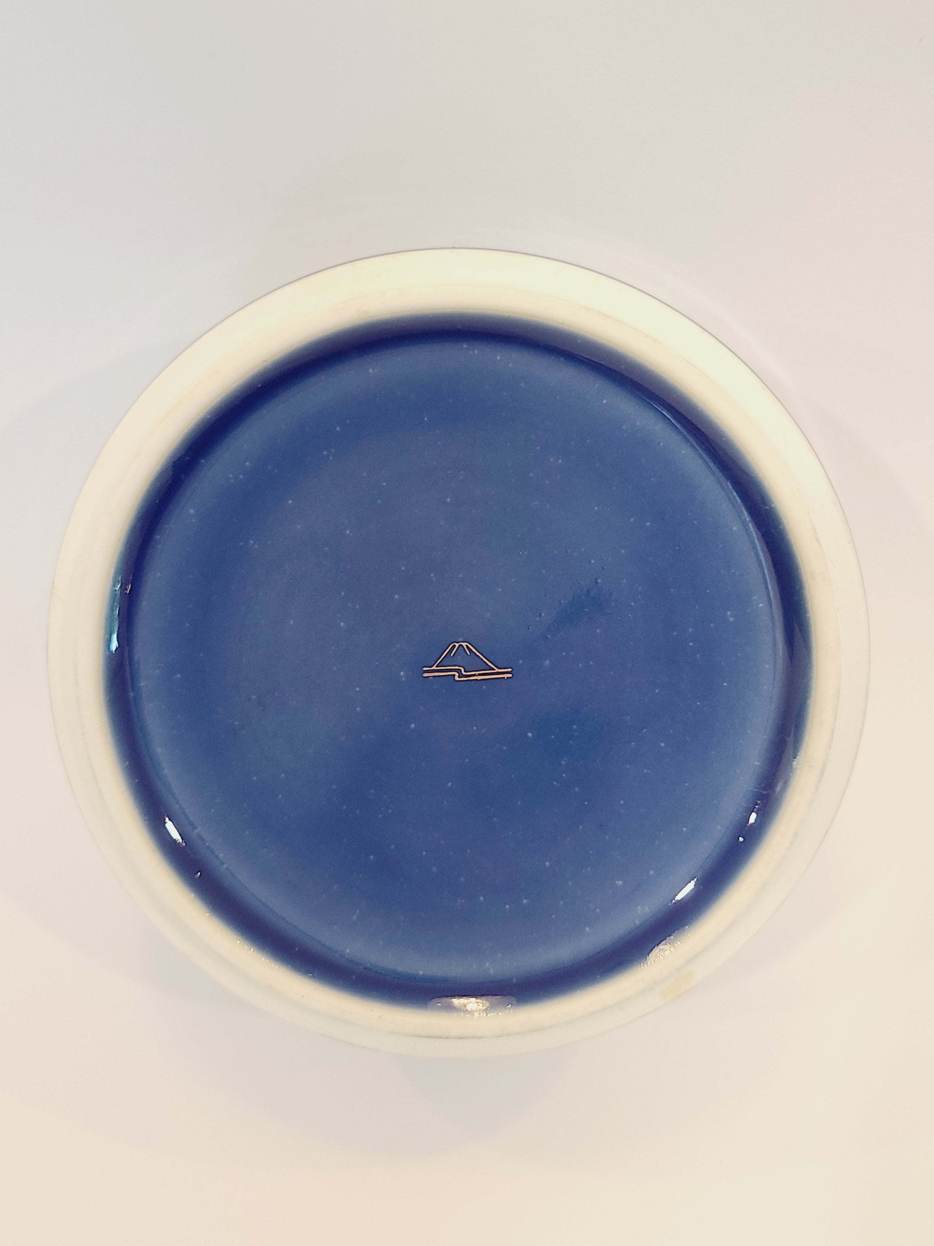 Bottom of Vintage Fukagawa Seiji 3-Tier Stacking Bowl Set with Lid in lapis blue with gold accents showing makers mark.