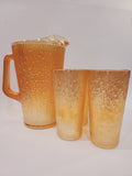 Jeannette Glass Depression-era carnival glass pitcher and 5 glasses set in Marigold Tree Bark pattern, iridescent orange-gold, USA circa 1920s–1930s.