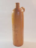 Antique 19th century terracotta colored stoneware bottle stamped with the name of Georg Kreuzberg and the Apollinaris Brunnen.