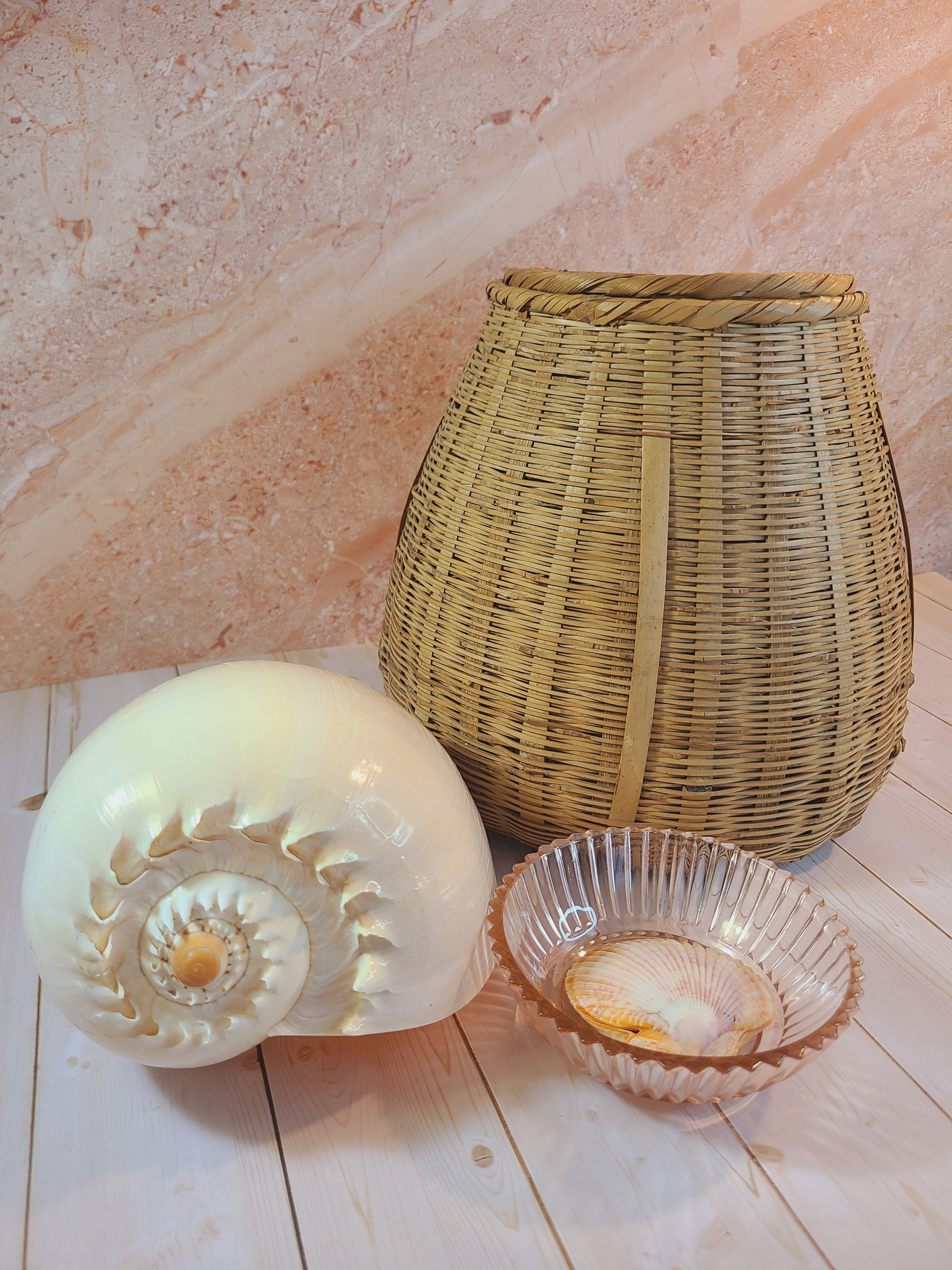 Vintage Blush colored Depression Glass Bowl with Ridged Detailing displayed with a basket and large seashell.