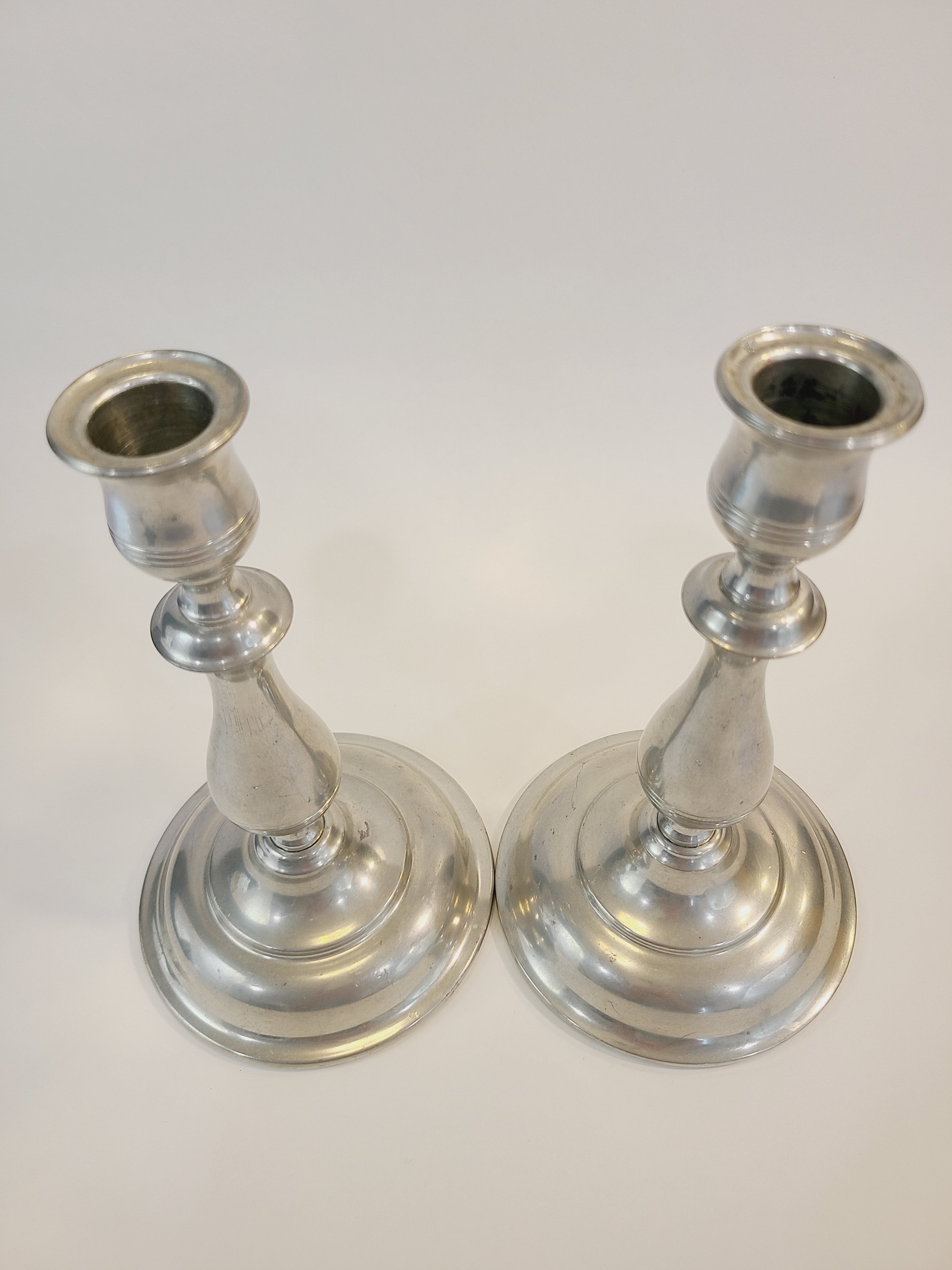 Top view of pair of vintage Stieff Pewter Candlesticks with DuPont stamp.