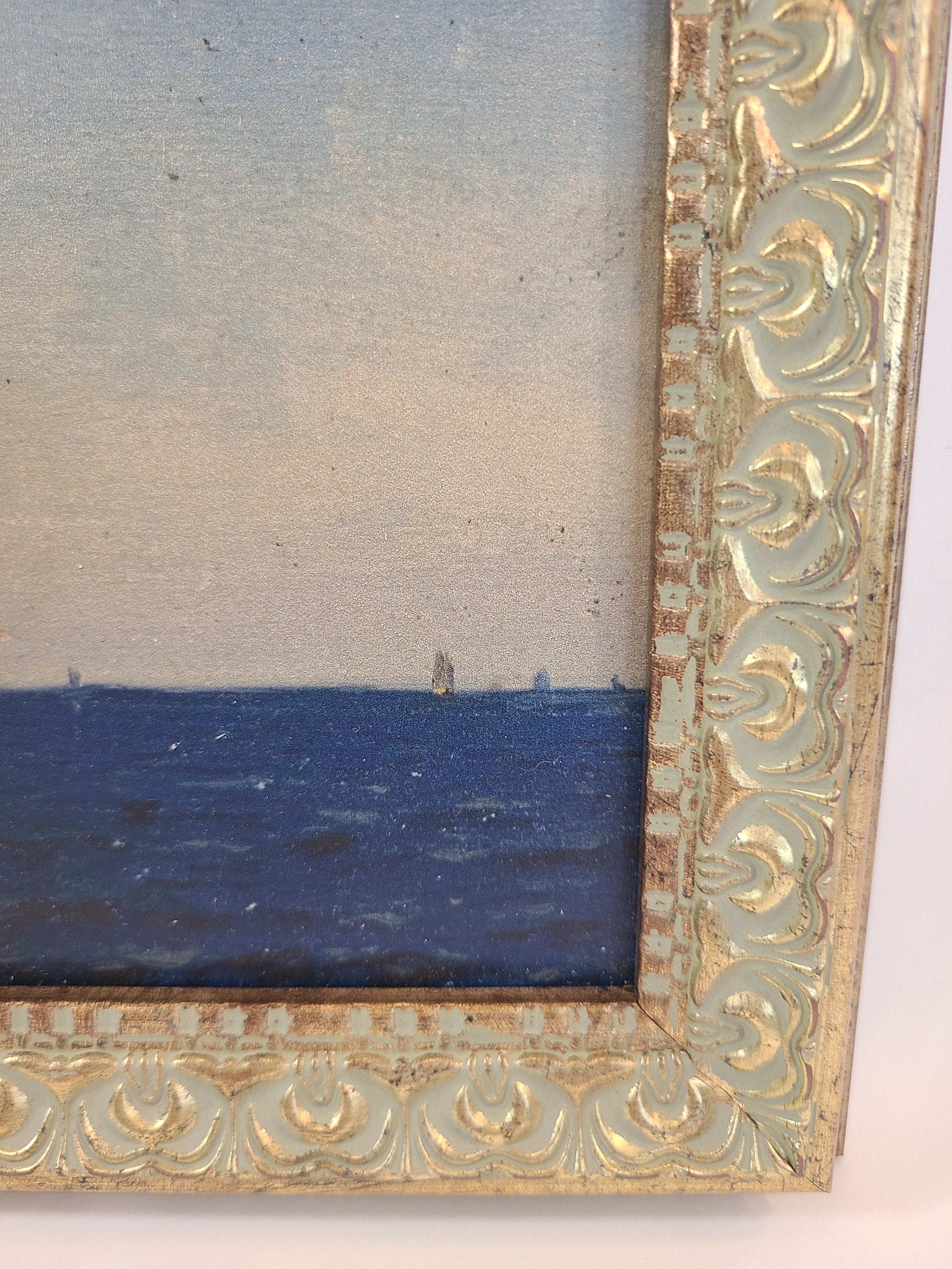 Close up of corner of Print of the painting Atlanterhavet by Norwegian artist Amaldus Nielsen showing intricate frame.