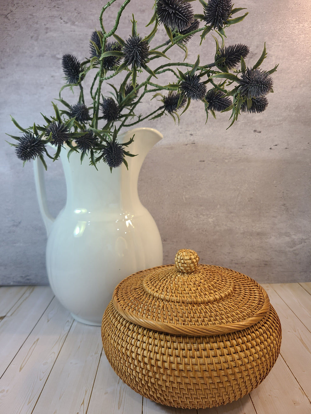 Antique white Alfred Meakin Royal Ironstone Pitcher holding flowers with lidded basket.