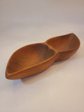 Vintage mid-century wooden bowl with a unique double-compartment leaf design, shown from an angled perspective against a plain off-white background.