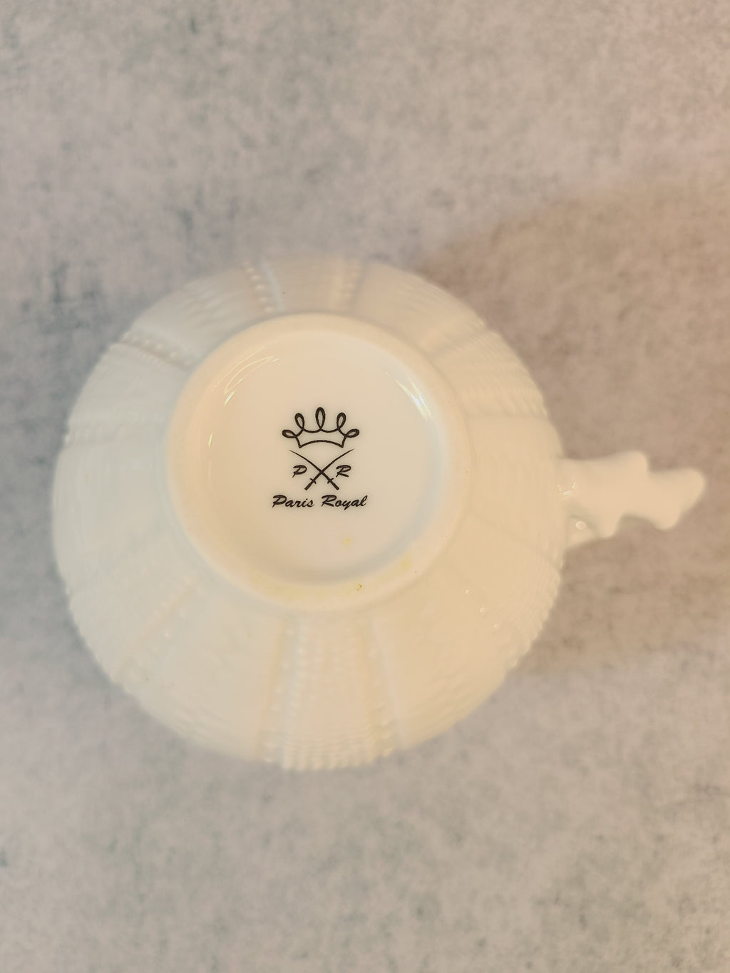 Vintage Paris Royal pitcher or creamer with sea urchin design showing makers mark on bottom.