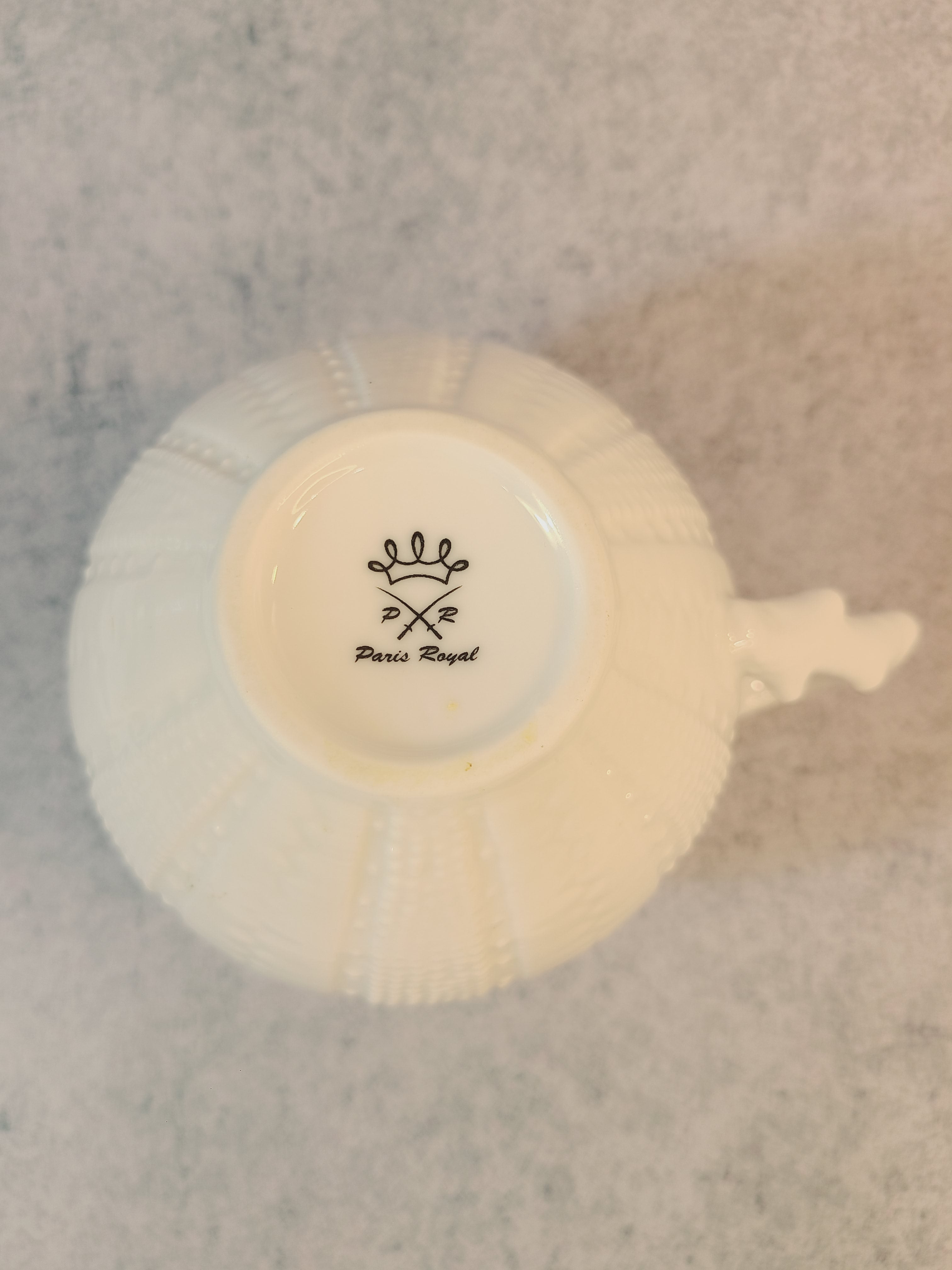 Vintage Paris Royal pitcher or creamer with sea urchin design showing makers mark on bottom.