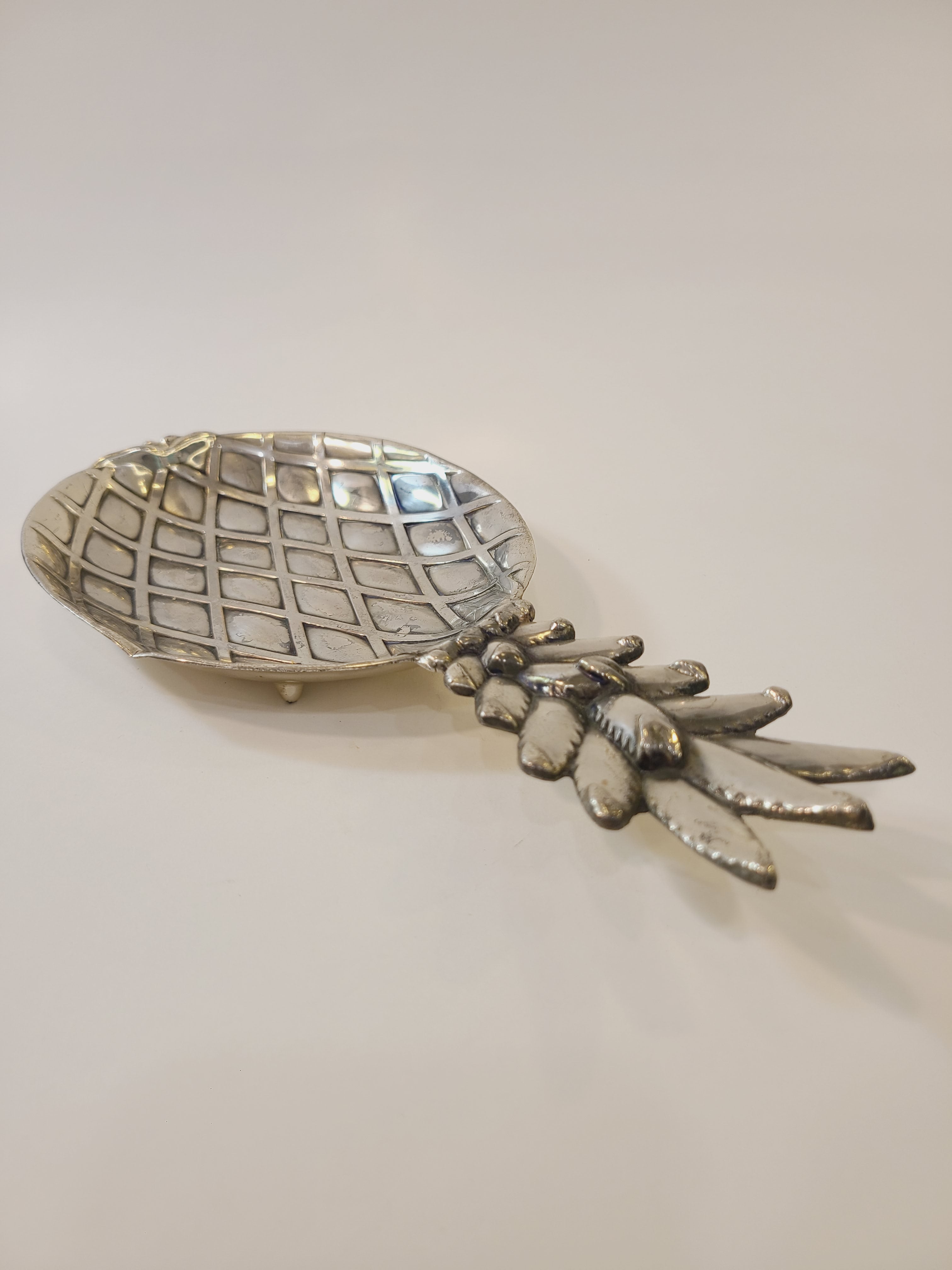 Vintage pineapple silver tone metal dish made in Japan by Matsumoto for the Eleanor retail line on a white background.