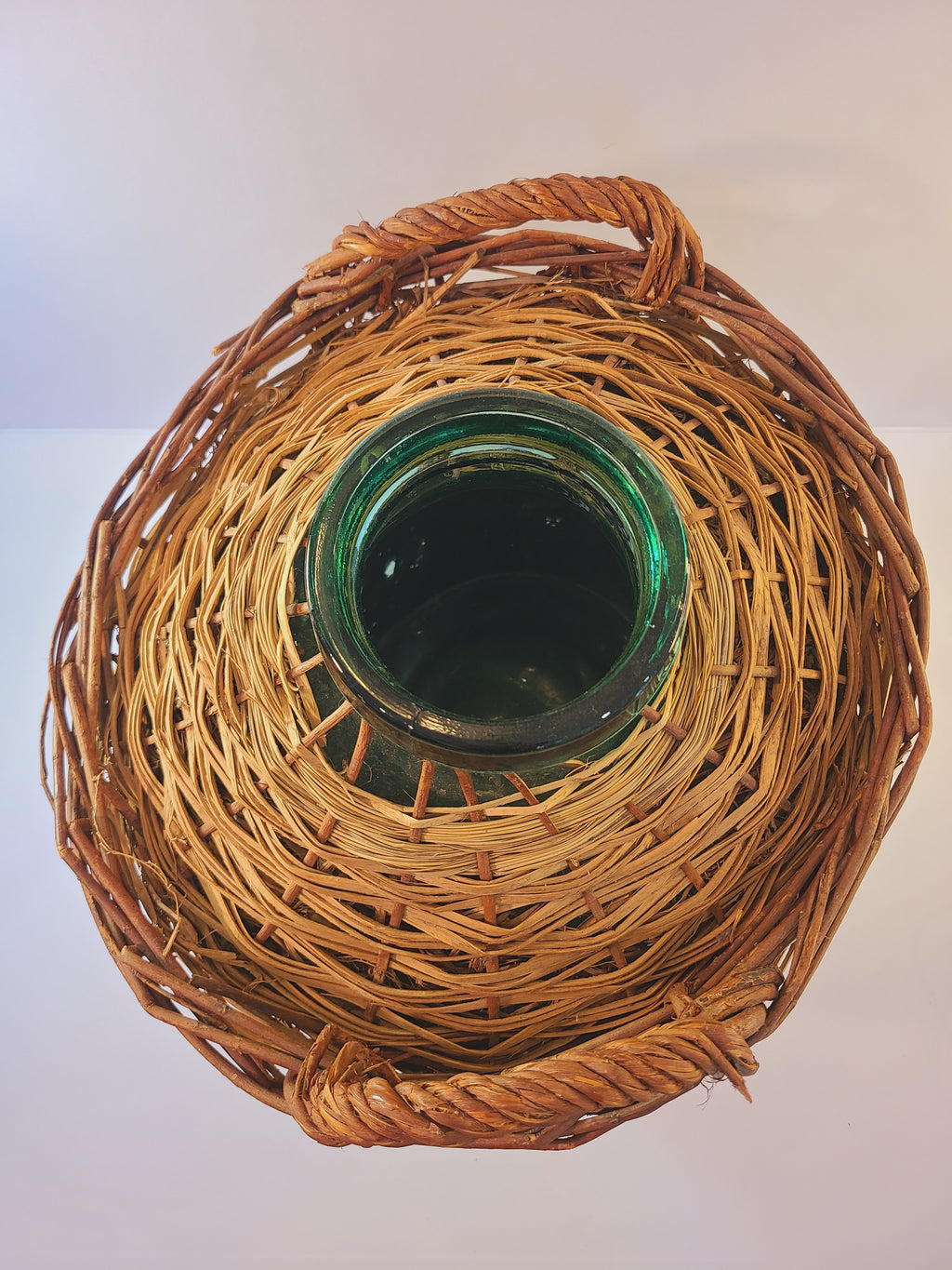 Top view of blue-green Viresa Demijohn with Original Rattan circa 1960s 15 inch