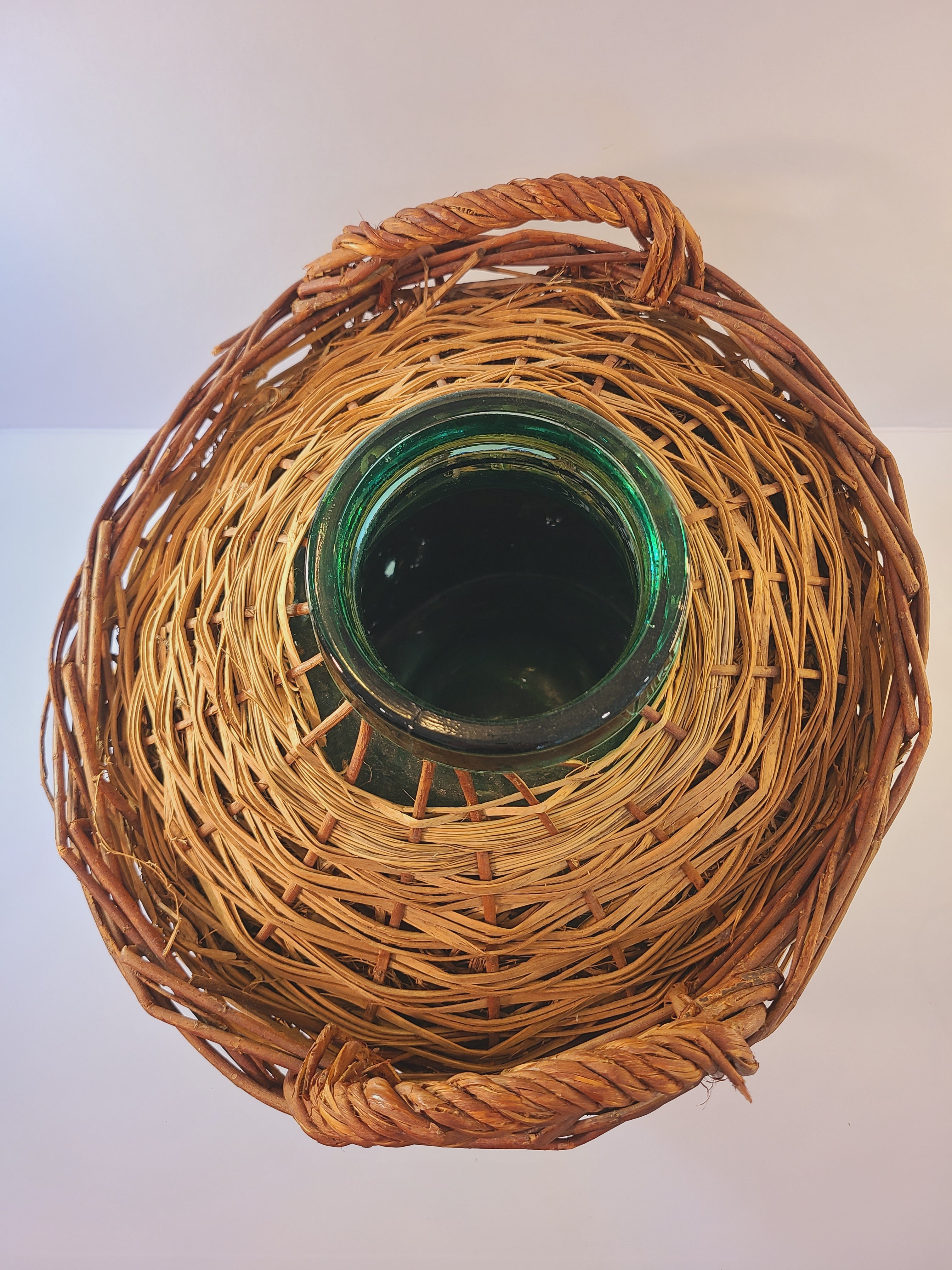 Top view of blue-green Viresa Demijohn with Original Rattan circa 1960s 15 inch
