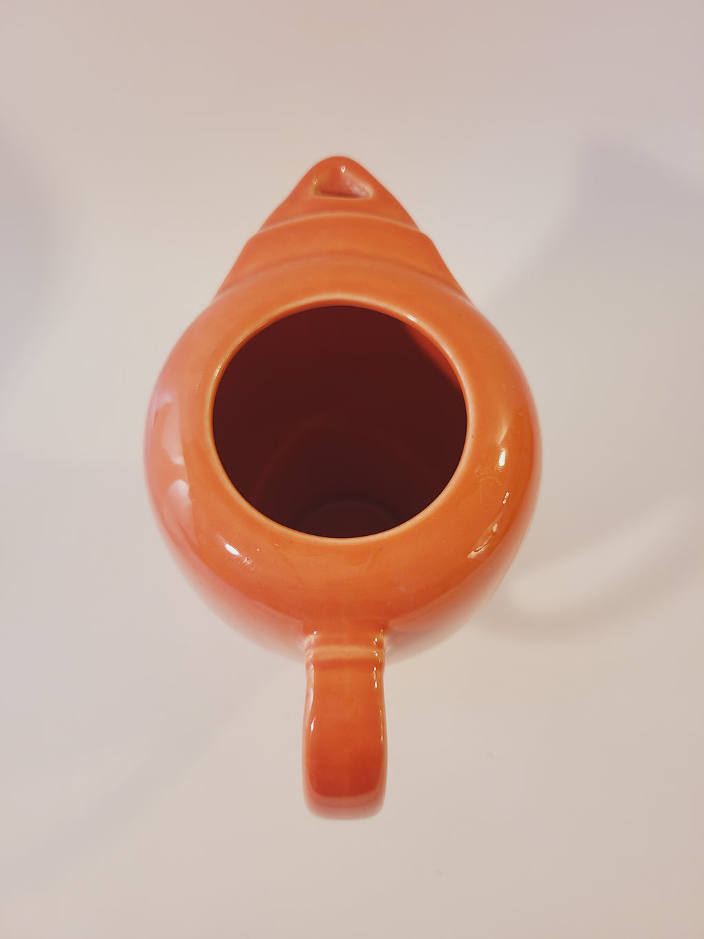 Fiesta carafe in color Persimmon set photographed from above.