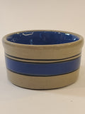 Petite vintage gray crock with blue stripes viewed from the side.