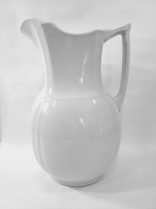 Antique white Alfred Meakin Royal Ironstone Pitcher on white background.