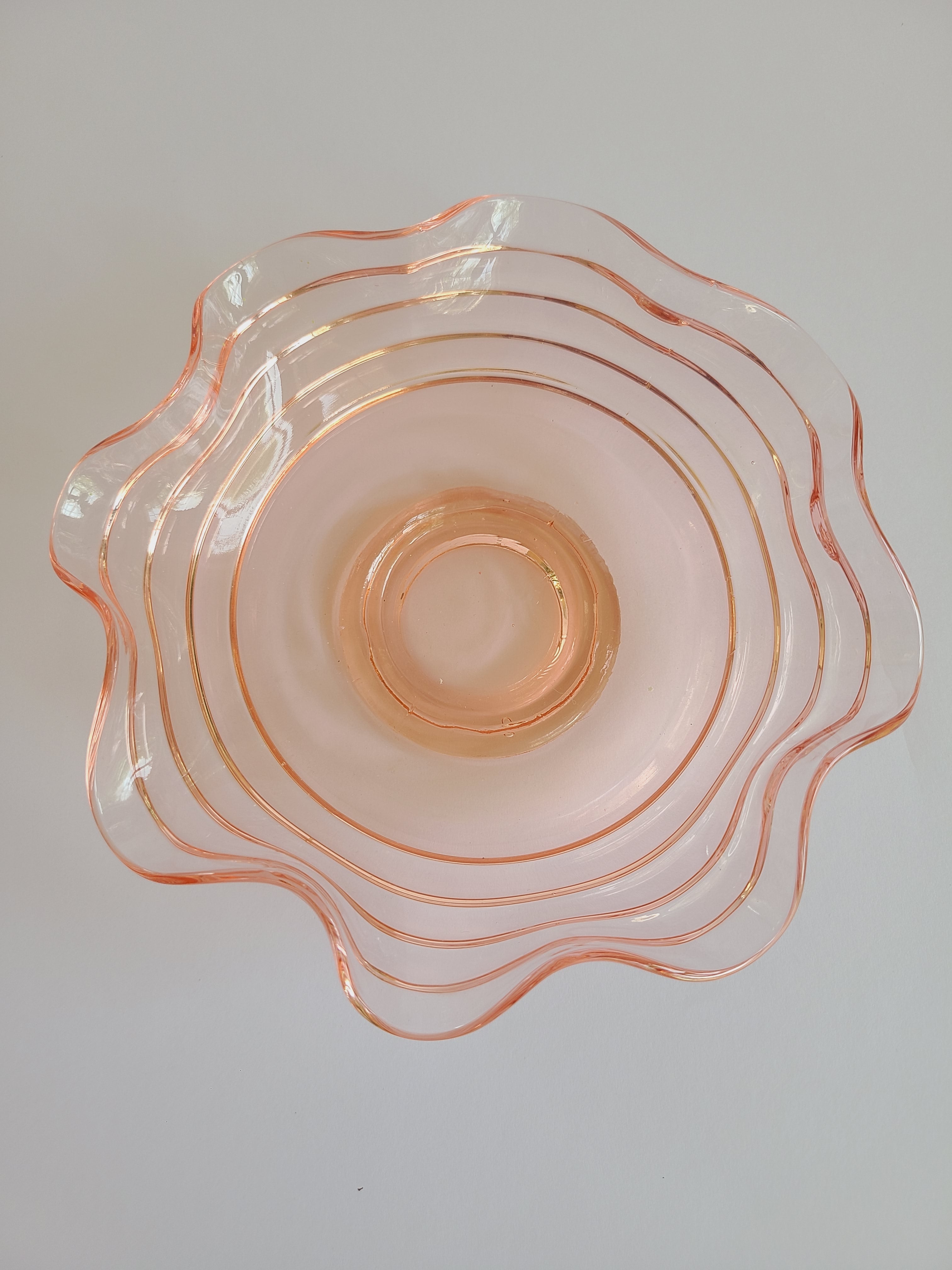 Vintage Blush colored Depression Glass Bowl with Ruffled Edge photographed from directly above.