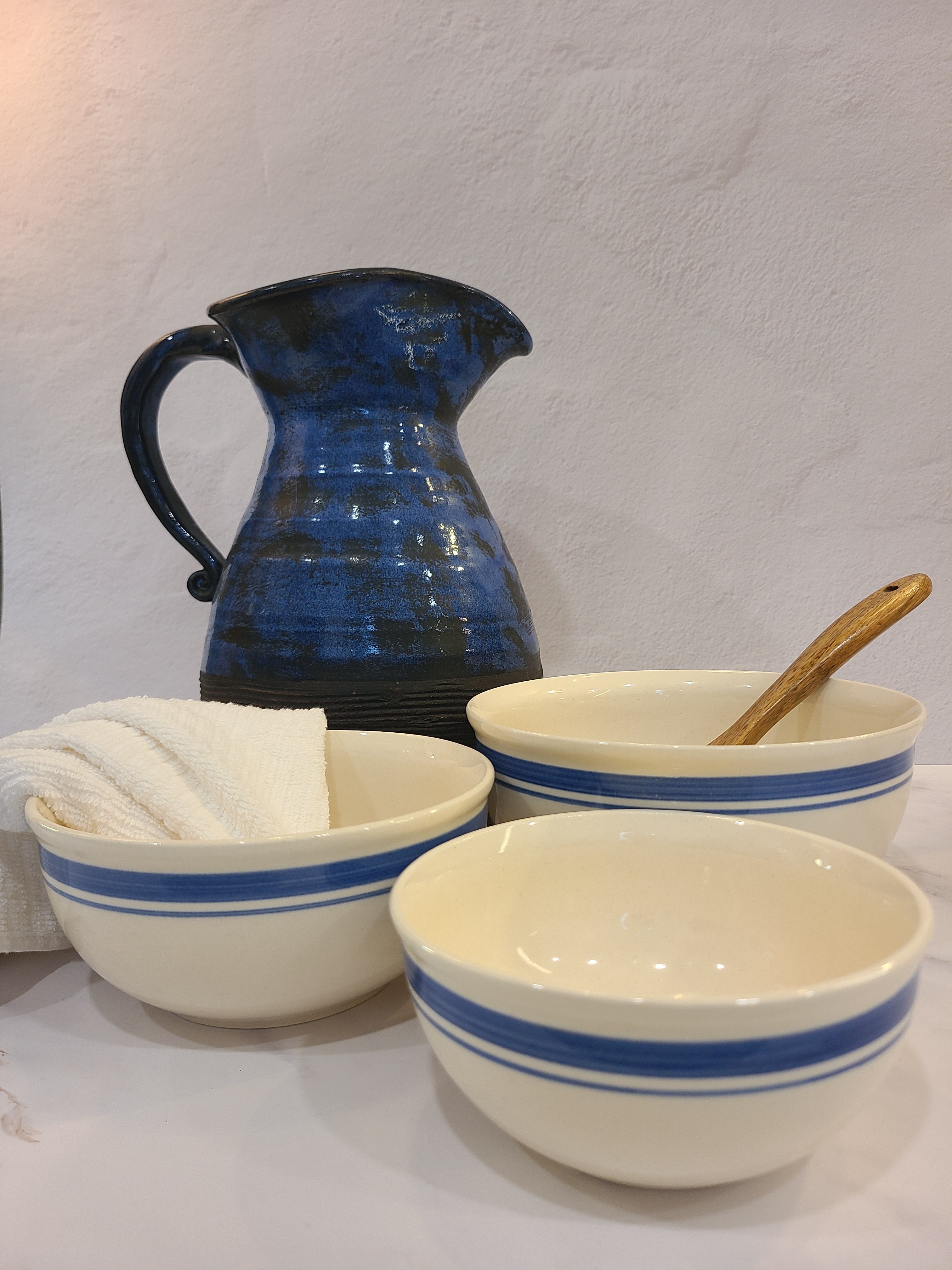 Vintage cream-colored ceramic bowls with blue accents made in East Germany DDR.
