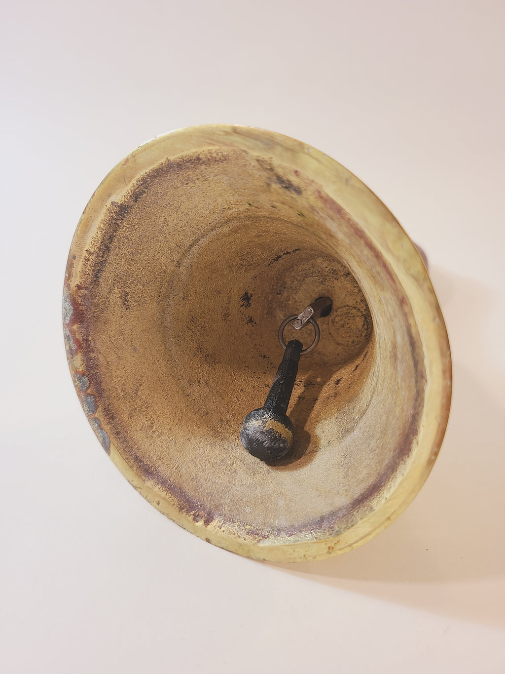Interior of vintage brass bell.