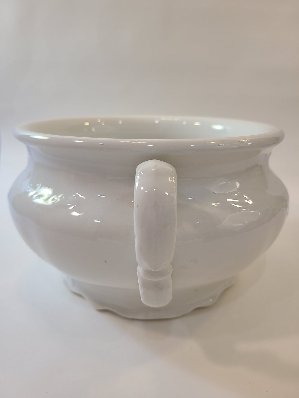 Antique white Mellor, Taylor & Co. English Ironstone Chamber Pot photographed to highlight the handle.