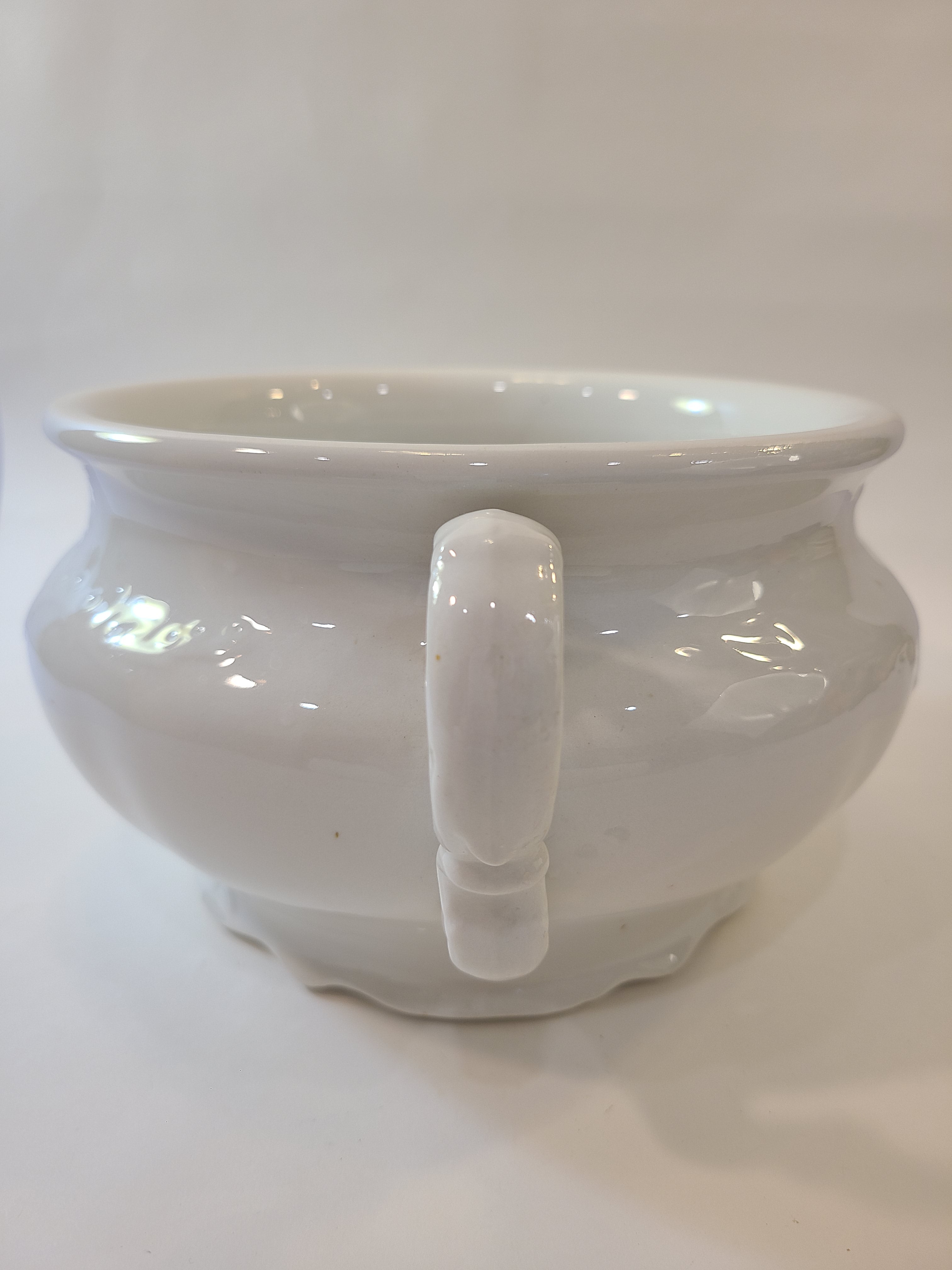 Antique white Mellor, Taylor & Co. English Ironstone Chamber Pot photographed to highlight the handle.