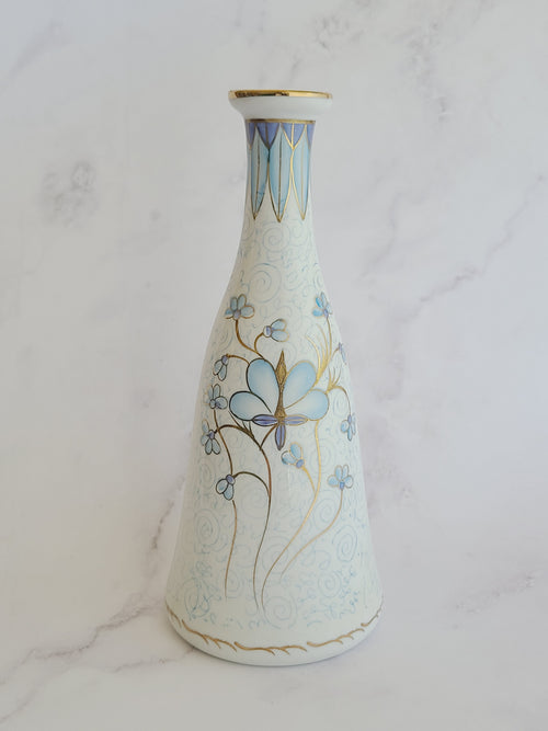Andrea by Sadek vintage white porcelain vase made in Japan hand-painted with light blue floral motifs, gold accents, and a blue-and-gold patterned band at the neck. 
