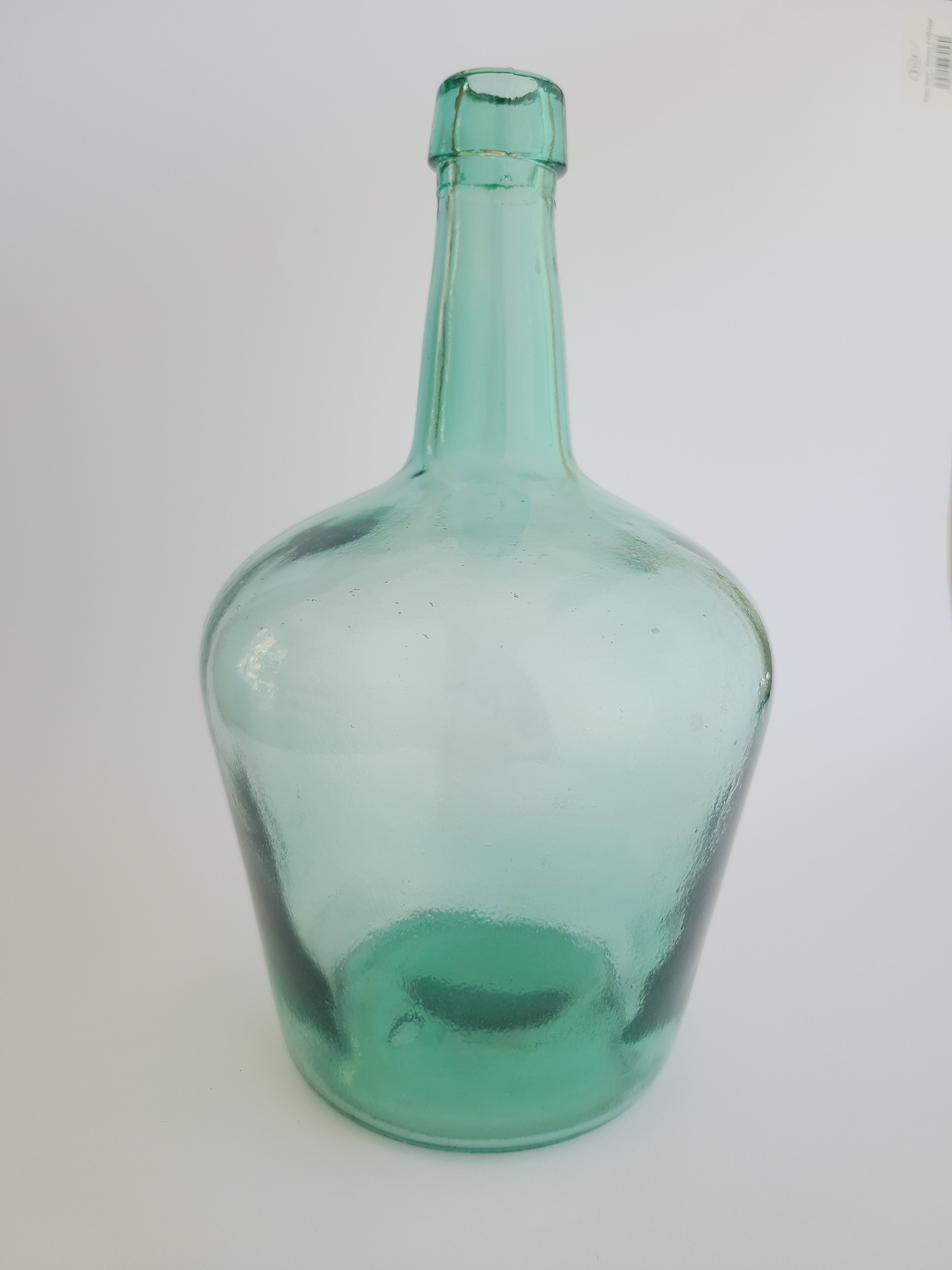 Vintage Green Glass Demijohn 10" on white background