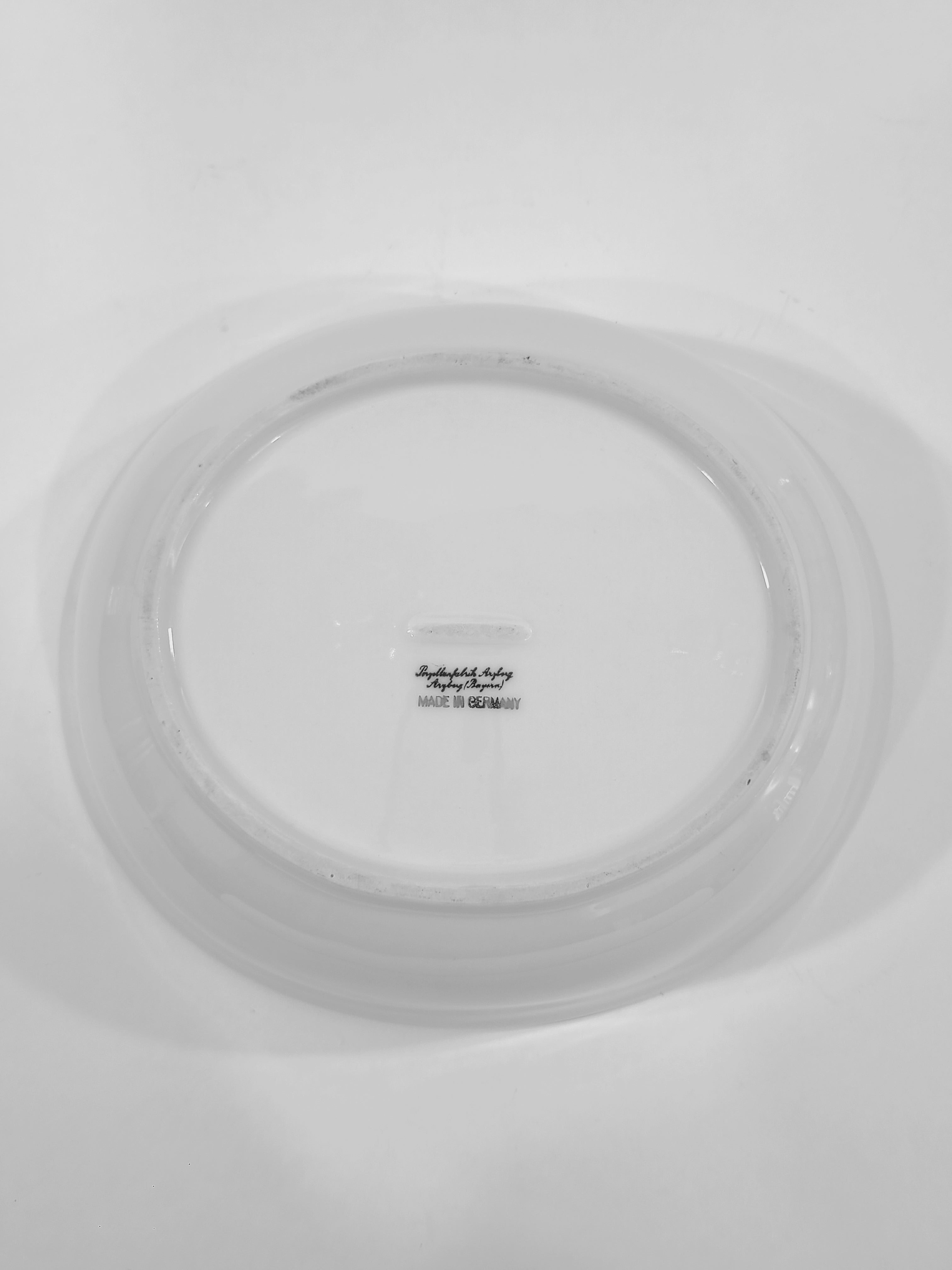 Bottom of Vintage white porcelain Arzberg Form 1382 Oval Vegetable Bowl by Hermann Gretsch on white background.
