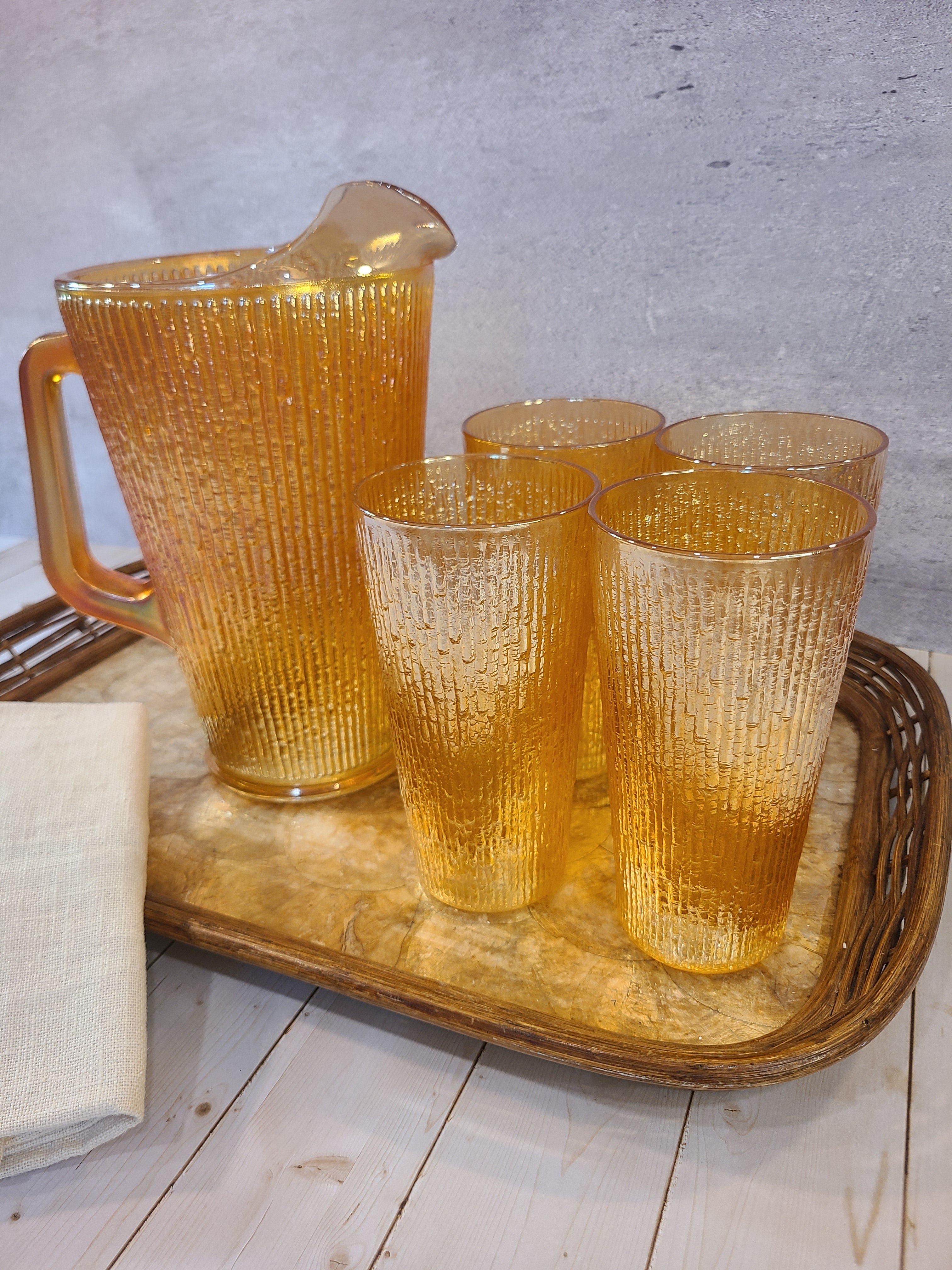 Vintage Capiz Shell Tray with Rattan Border holding vintage marigold glass pitcher and glasses