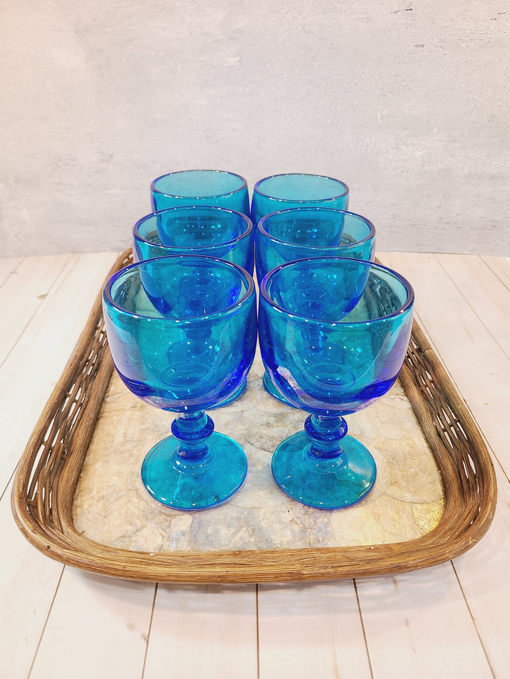 Vintage Capiz Shell Tray with Rattan Border holding vintage turquoise glass goblets