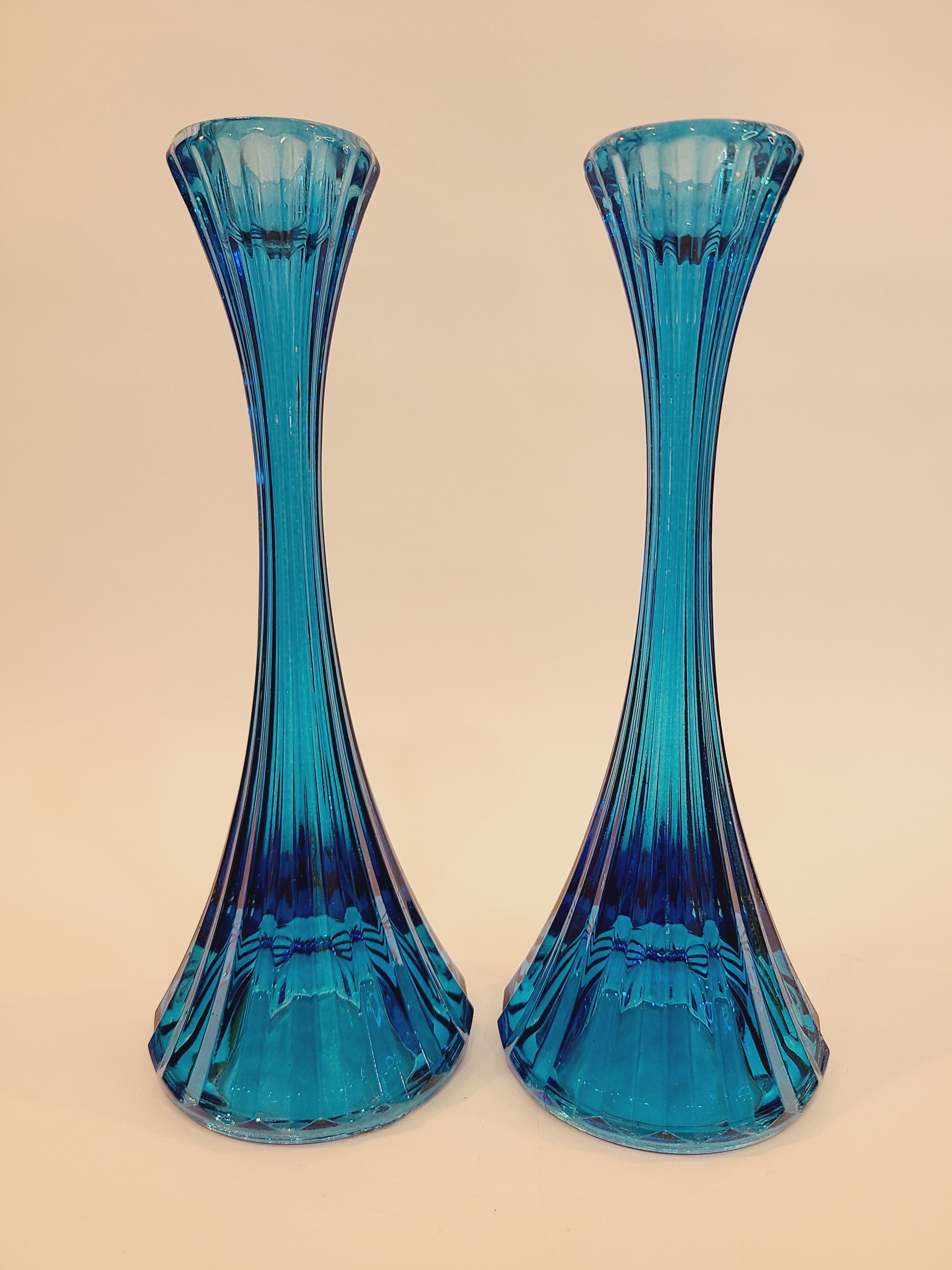 Pair of turquoise ridged glass candle holders, 1970s, 8 inches high, likely made in USA, shown side by side.