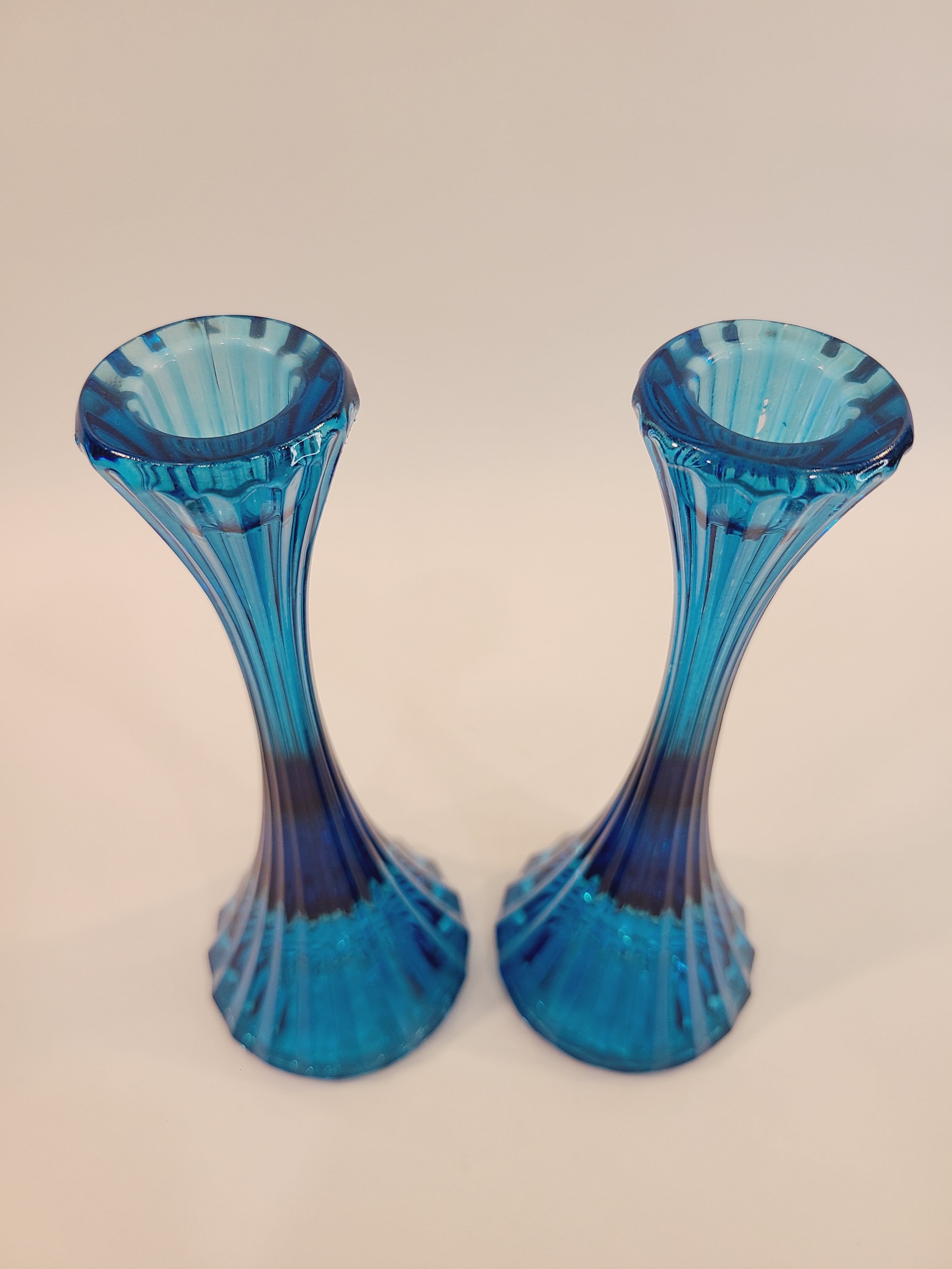 Pair of turquoise ridged glass candle holders, 1970s, 8 inches high, likely made in USA, shown from above.