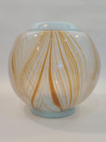 Handblown artisan glass vase in shape of a sphere, very pale aqua with orange feather-raked accents, 7 inches diameter.