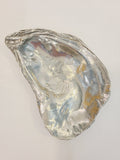 Pewter oyster shell dish, 3.75 inches by 2.25 inches.