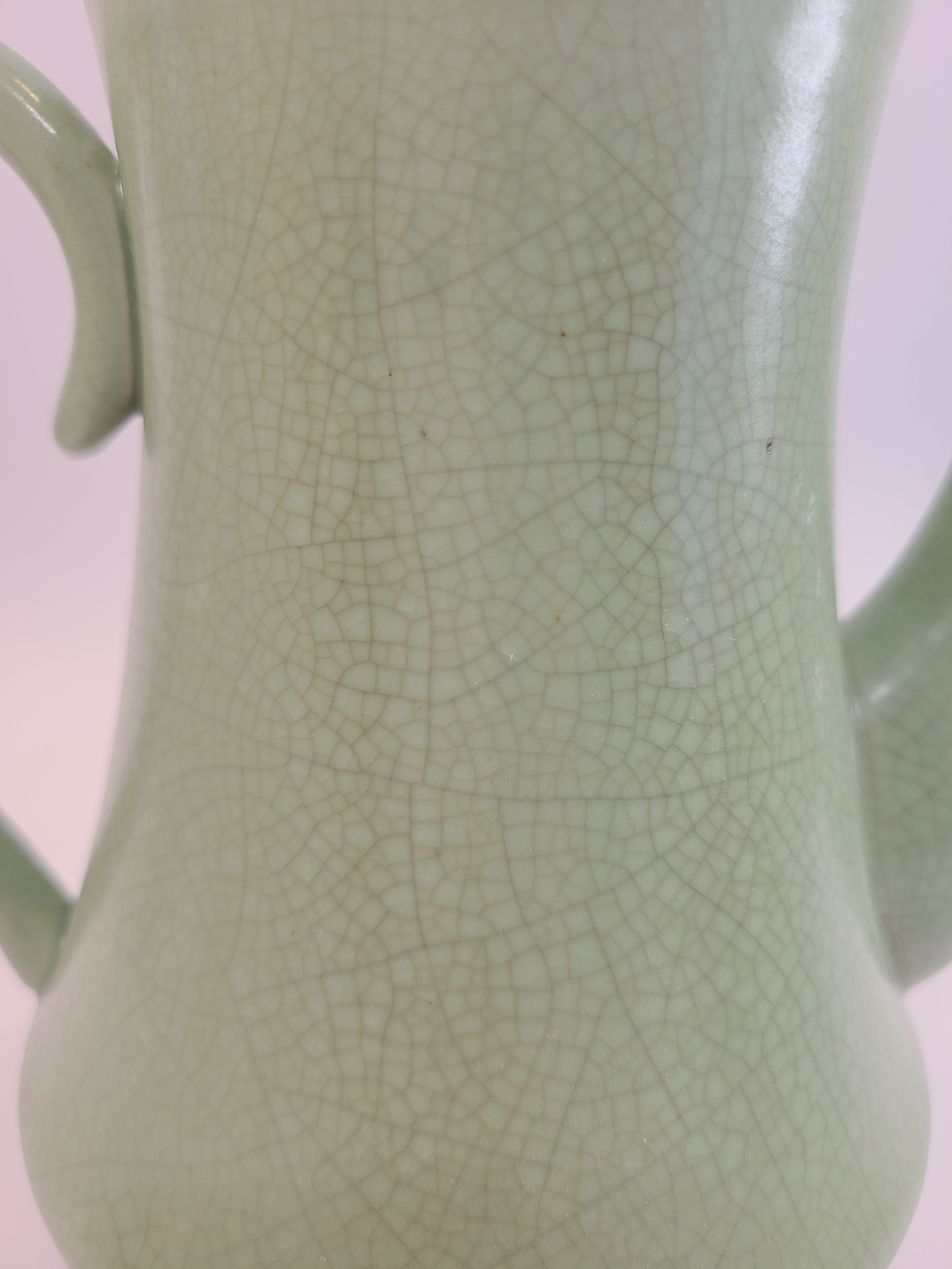 Close up of Celadon ceramic Teapot 7.5 inches high, showing crazing in glaze, made in Vietnam.