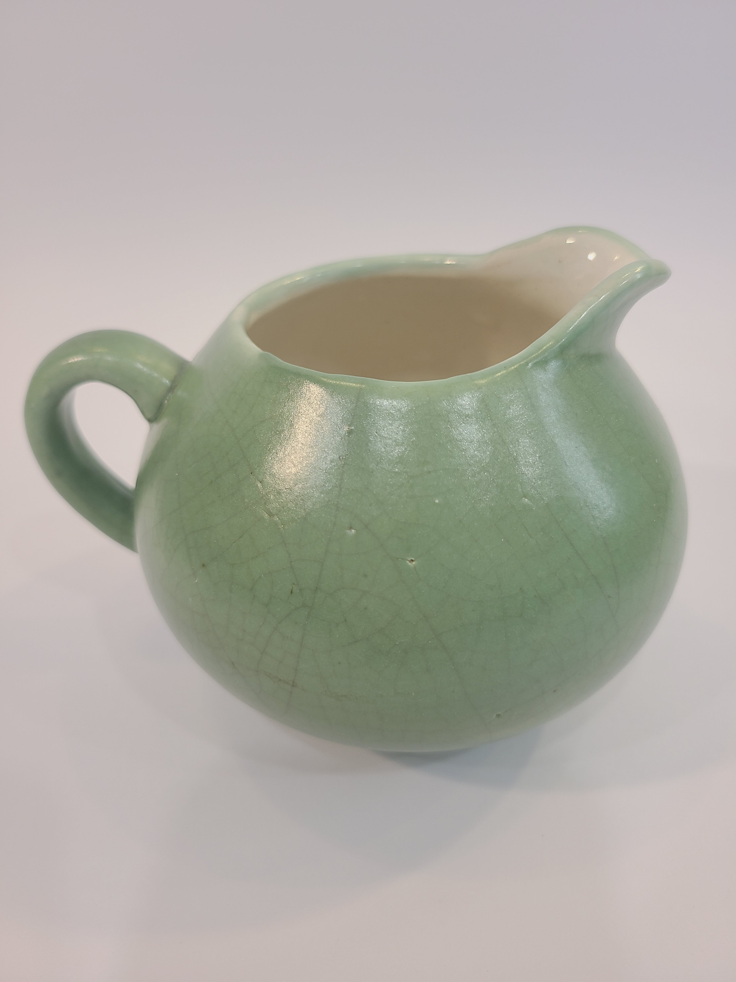 Celadon ceramic Creamer 3.5 inches high made in Vietnam.