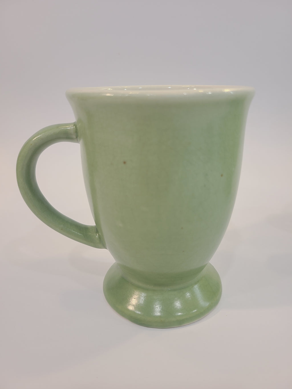 Celadon ceramic mug 4.5 inches high made in Vietnam. limited crazing.
