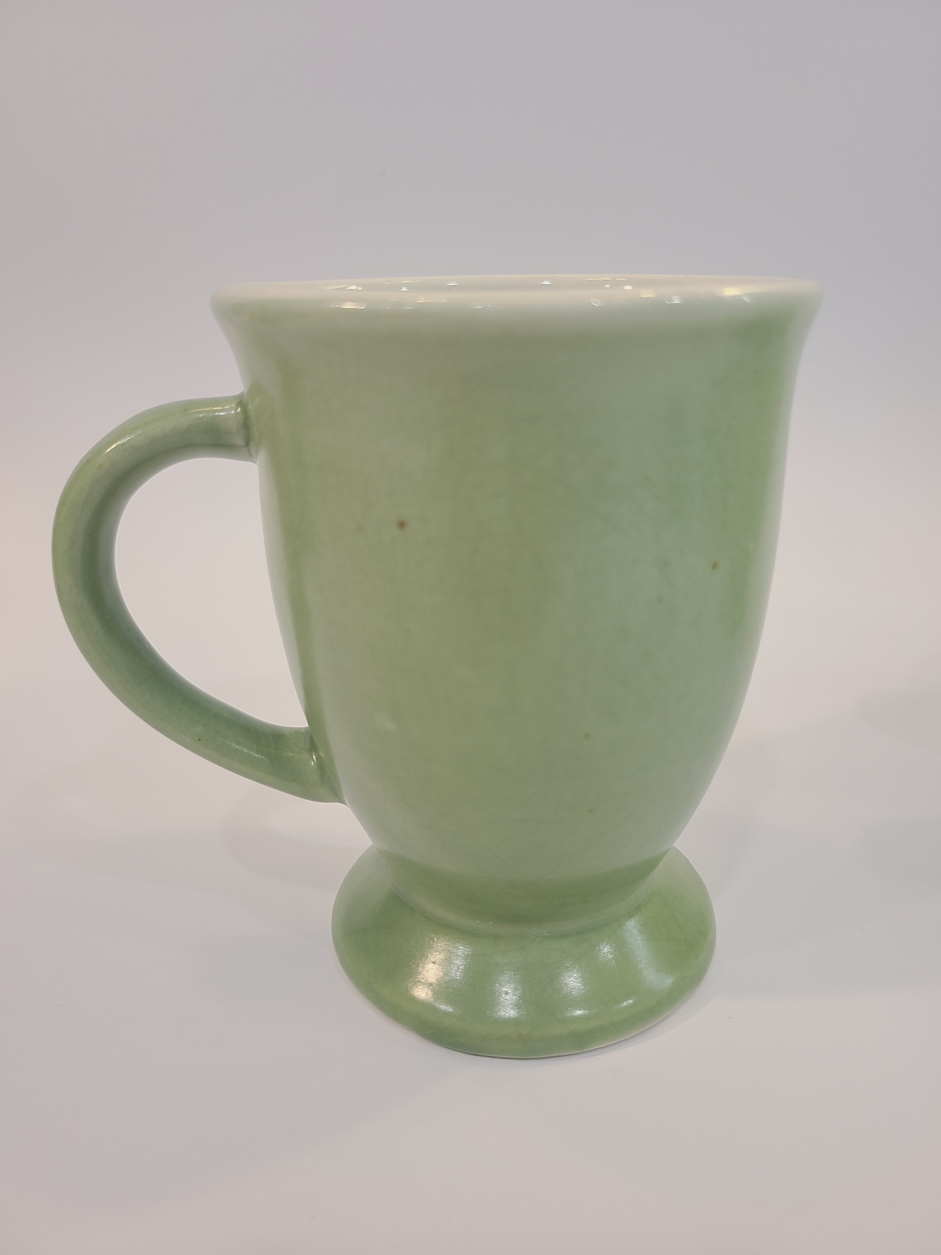 Celadon ceramic mug 4.5 inches high made in Vietnam. limited crazing.