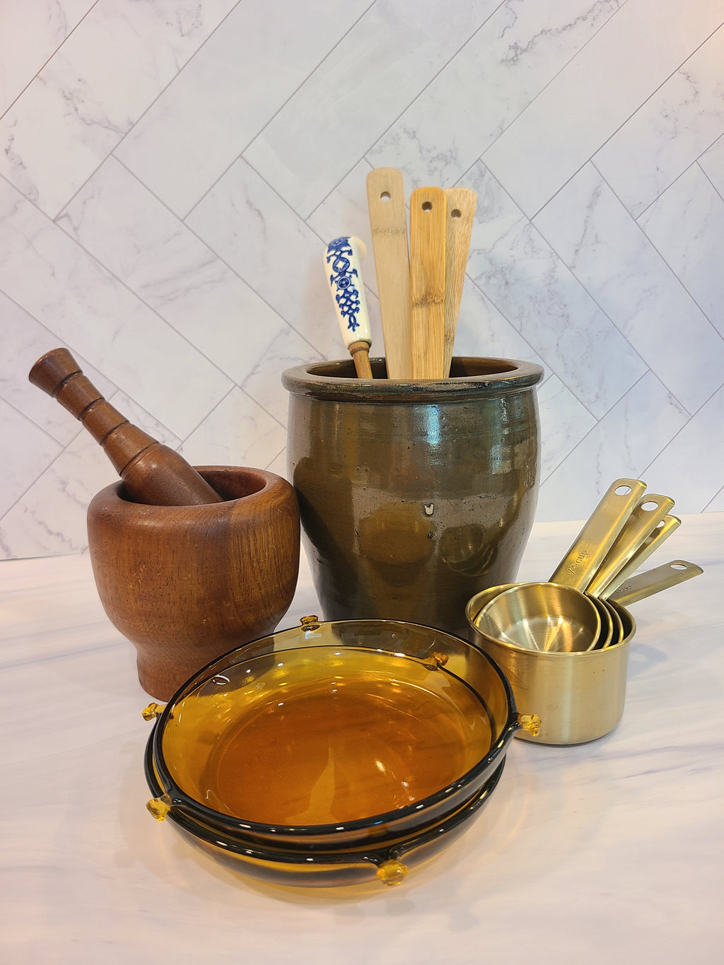 Antique Turned Wood Mortar and Pestle, Mortar 4.25 inches high by 4.25 inches diameter; Pestle 6 inches high, displayed with brown crock, amber glass dishes, and brass measuring cups.