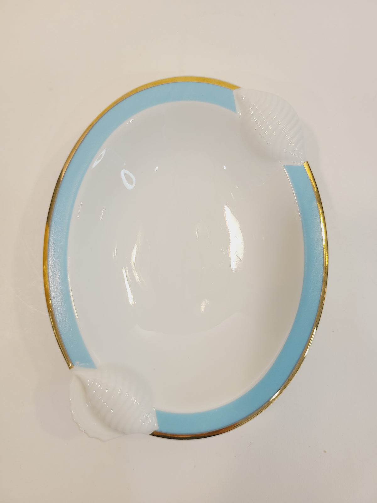 Top view of Ben Rickert Fine China Dish with Seashell Embossed Rim and aqua and gold trim 1980s