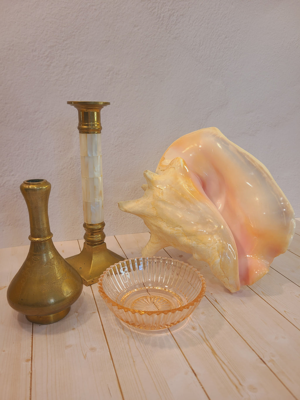 Brass and Mother of Pearl Hollywood Regency Candle Holder 1970s shown with shell, glass bowl, and brass vase.