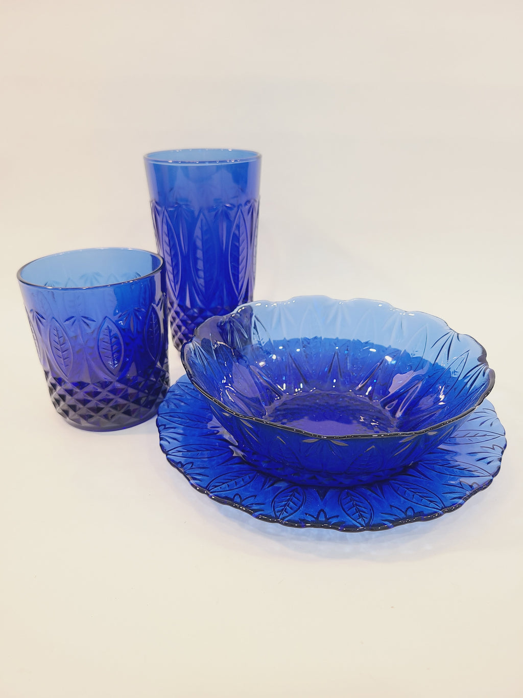 Avon Royal Sapphire cobalt blue glass collection — highball glass, rocks glass, soup bowl, and salad plate, vintage France