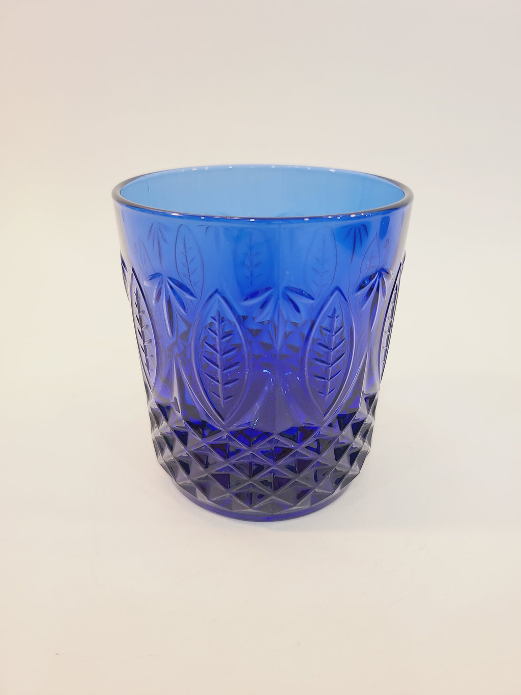 Avon Royal Sapphire cobalt blue rocks glass, full view showing embossed leaf and diamond-optic pattern — vintage France