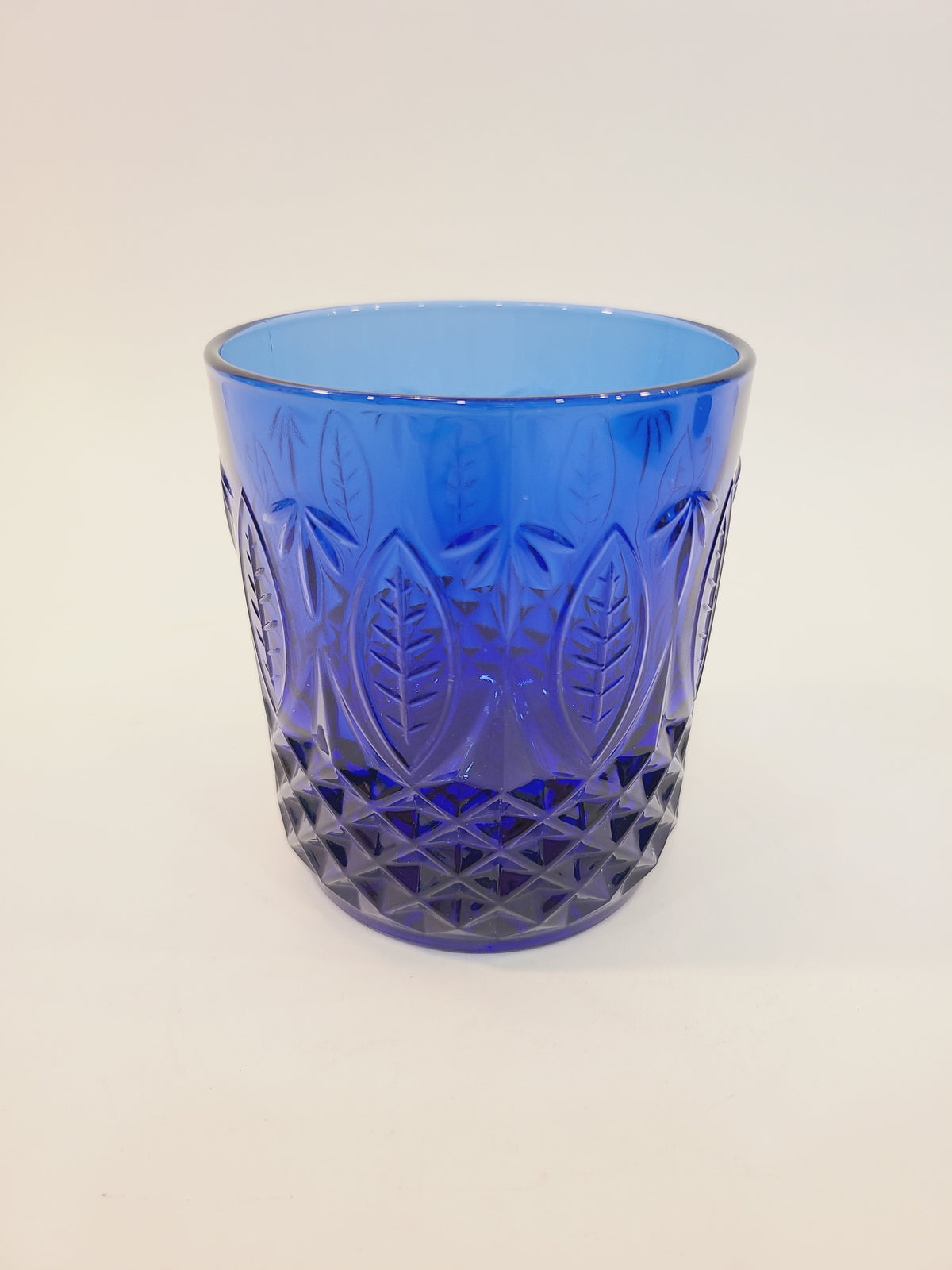 Avon Royal Sapphire cobalt blue rocks glass, full view showing embossed leaf and diamond-optic pattern — vintage France