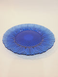 Avon Royal Sapphire cobalt blue glass salad plate, angled view showing embossed leaf rim and diamond-optic texture — France