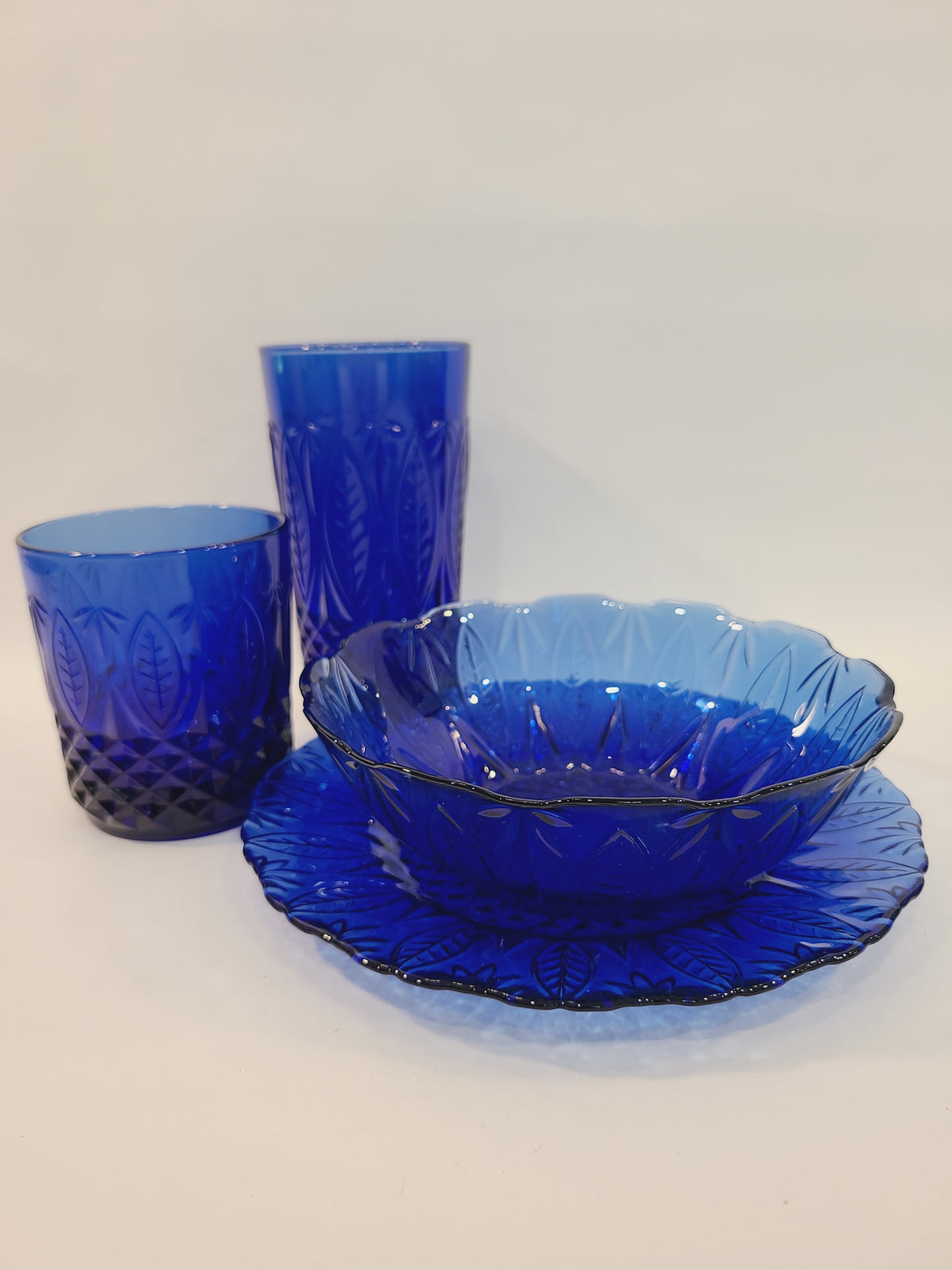 Avon Royal Sapphire cobalt blue glass collection — salad plate, soup bowl, rocks glass, and highball glass, vintage France
