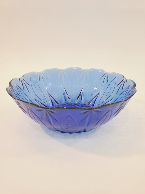 Avon Royal Sapphire cobalt blue glass cereal bowl, side-angle view showing scalloped rim and embossed leaf pattern — vintage France