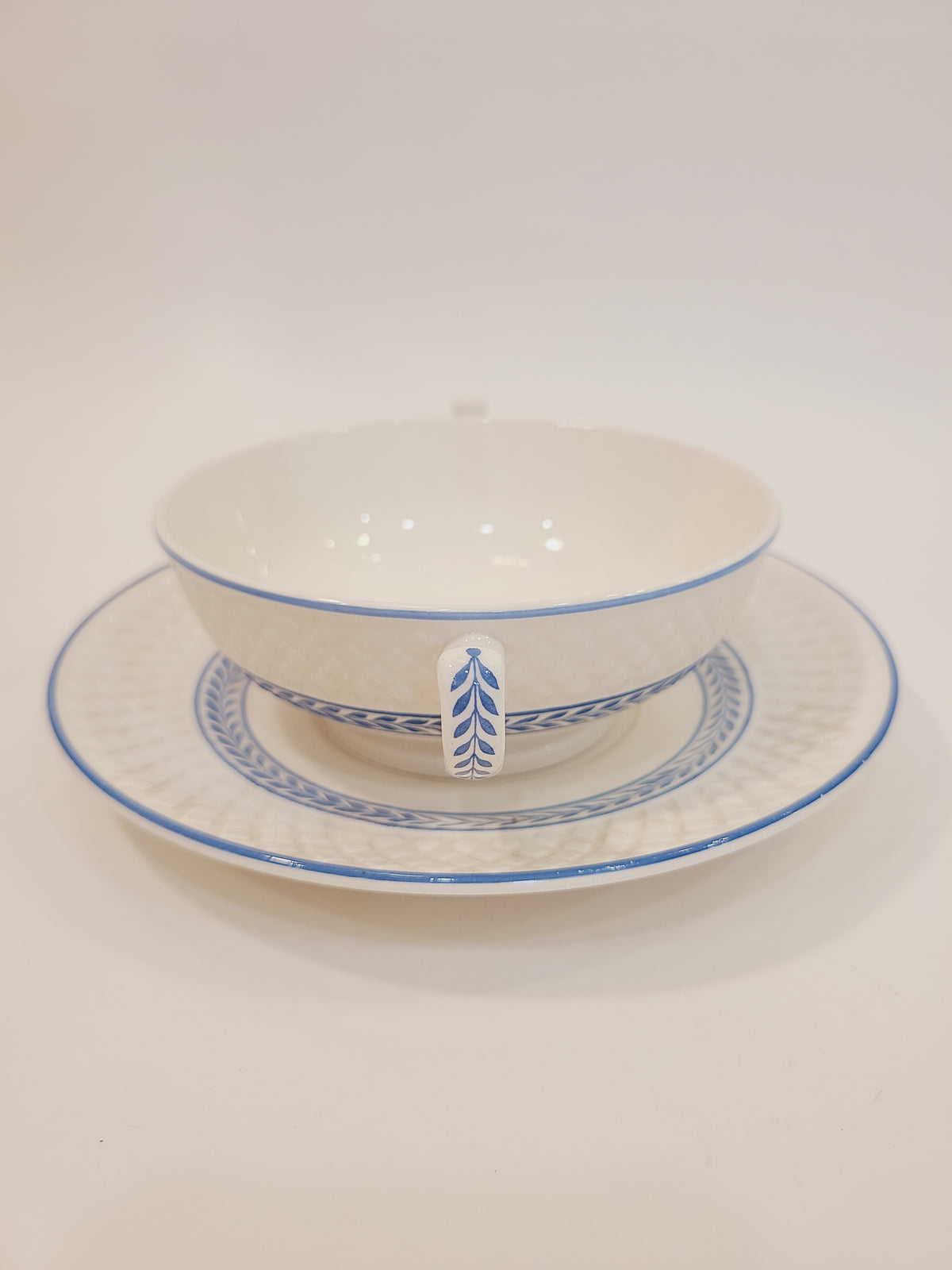 Copeland Spode Elaine Mansard cream soup bowl with two handles on underplate, three-quarter view — antique English creamware 1939