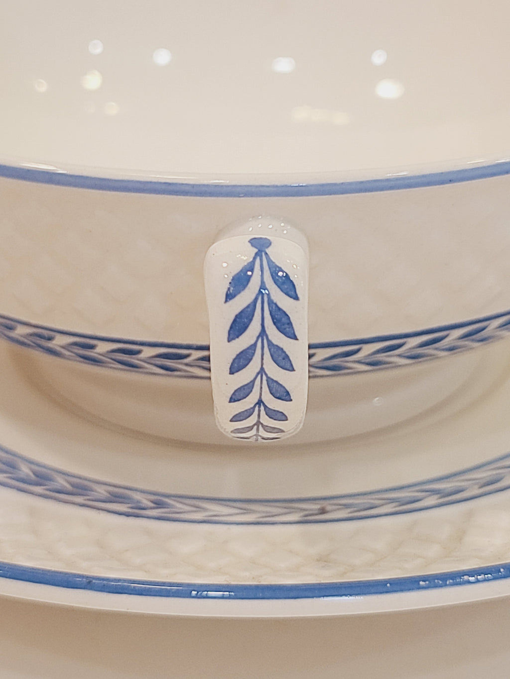 Close up view of Copeland Spode Elaine Mansard cup handle showing soft blue laurel vine pattern 