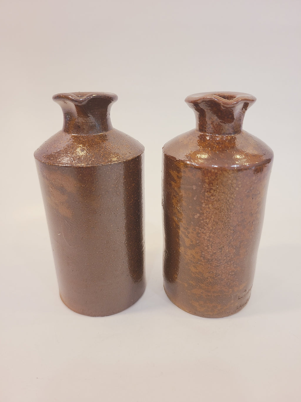 Pair of antique English salt-glazed stoneware ink bottles by Lovatt & Lovatt, Langley Mill — mottled ginger-brown glaze