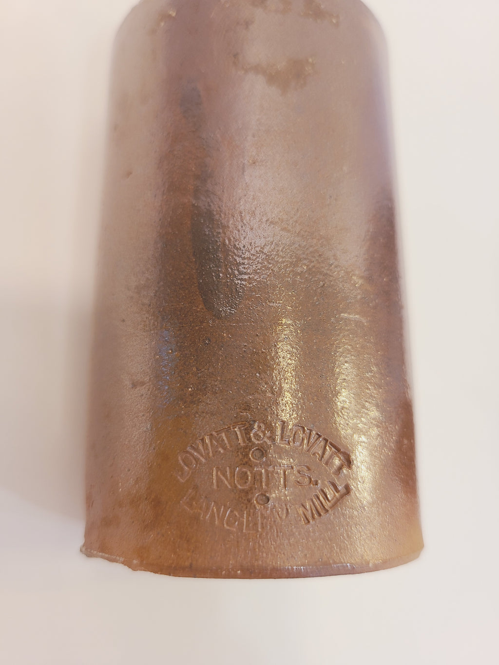 Lovatt & Lovatt Notts Langley Mill maker's stamp on antique salt-glazed stoneware ink bottle, produced 1895–1913
